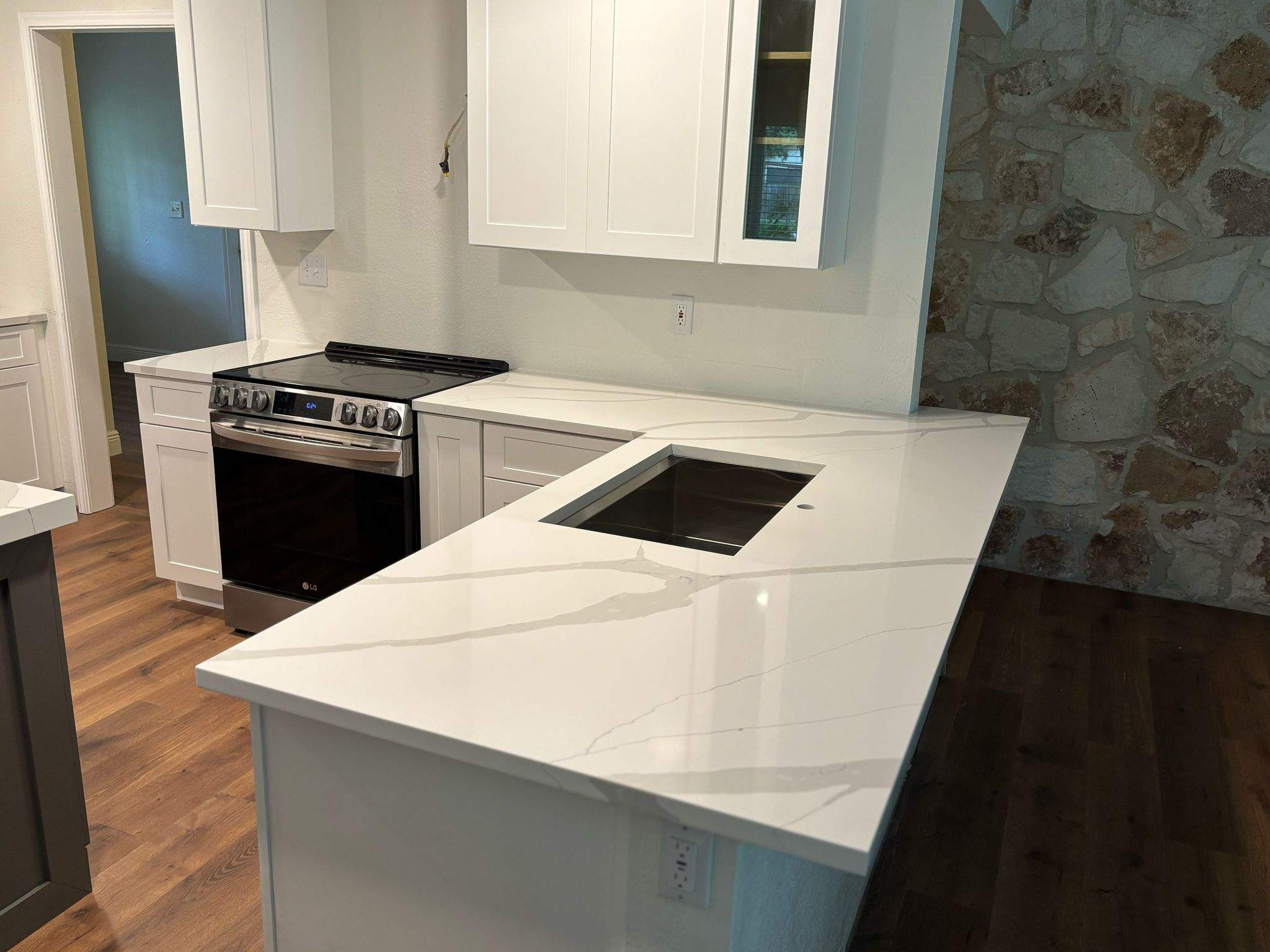 Modern Kitchen Renovation with White Shaker Cabinets in San Antonio by Mena stone surfaces
