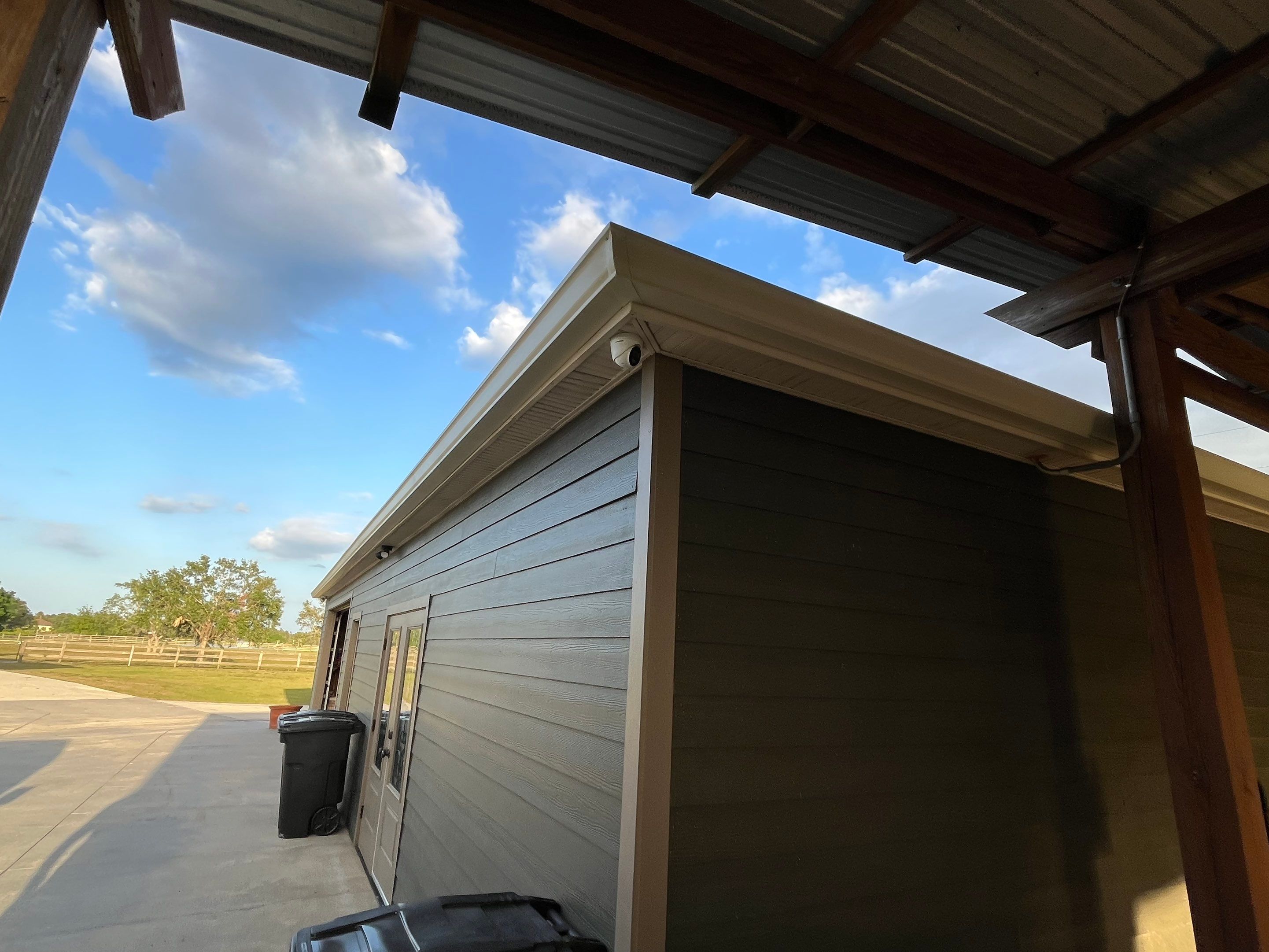  7-inch White seamless gutters and downspouts in Myakka City FL by Gutter Professors
