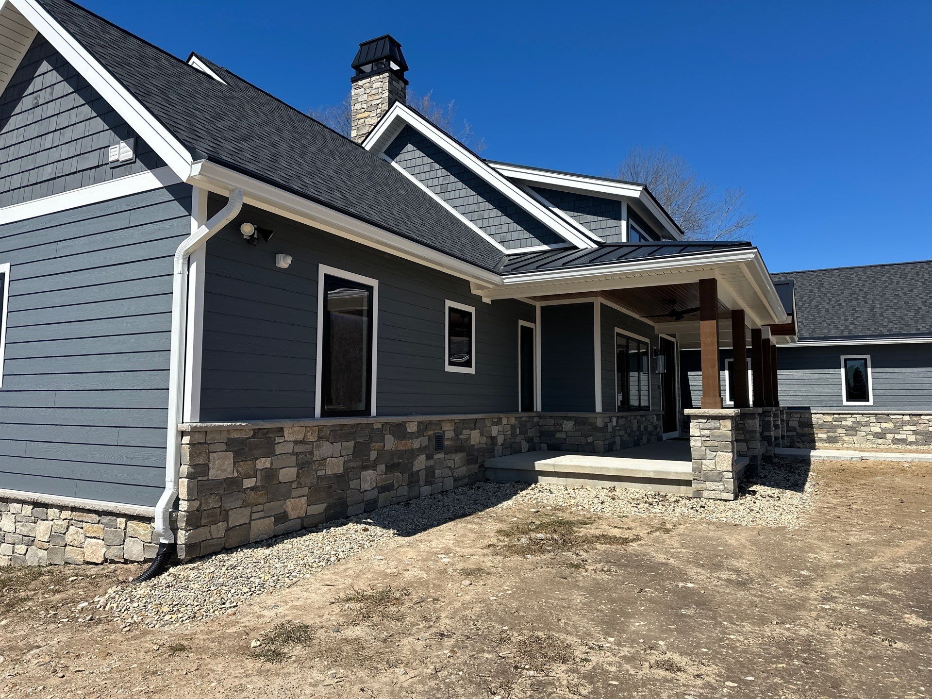Residential Gutter and Downspout Installation for Ellsworth Home Exterior by Rainbow Seamless Systems