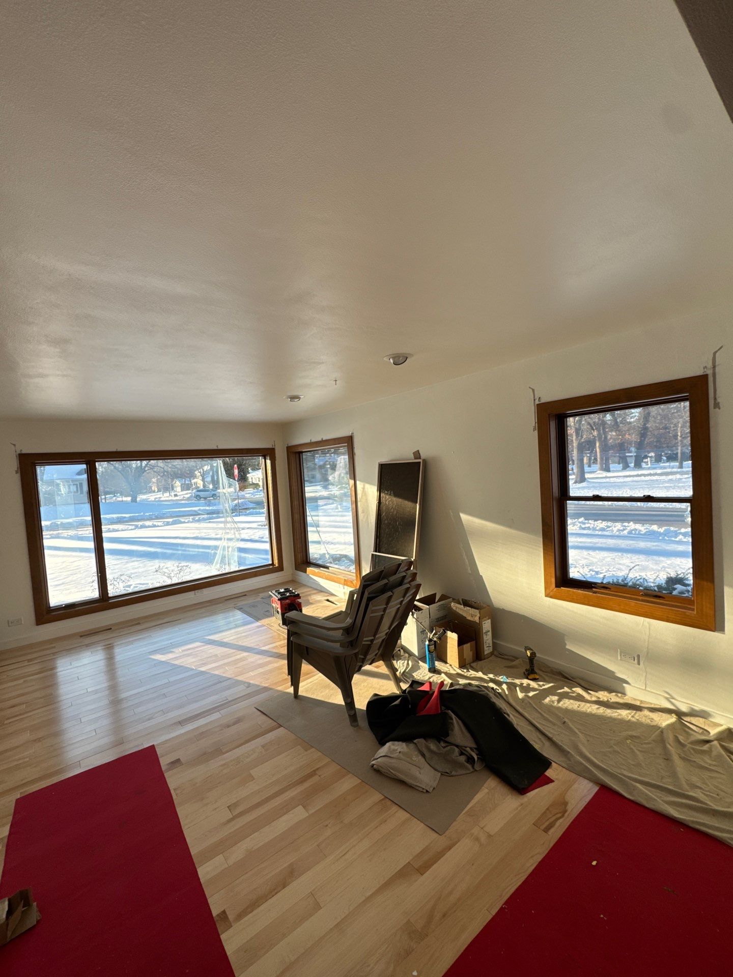 Black-Frame Pella Lifestyle Upgrade on a Partial Brick Home by United Windows and Siding LLC