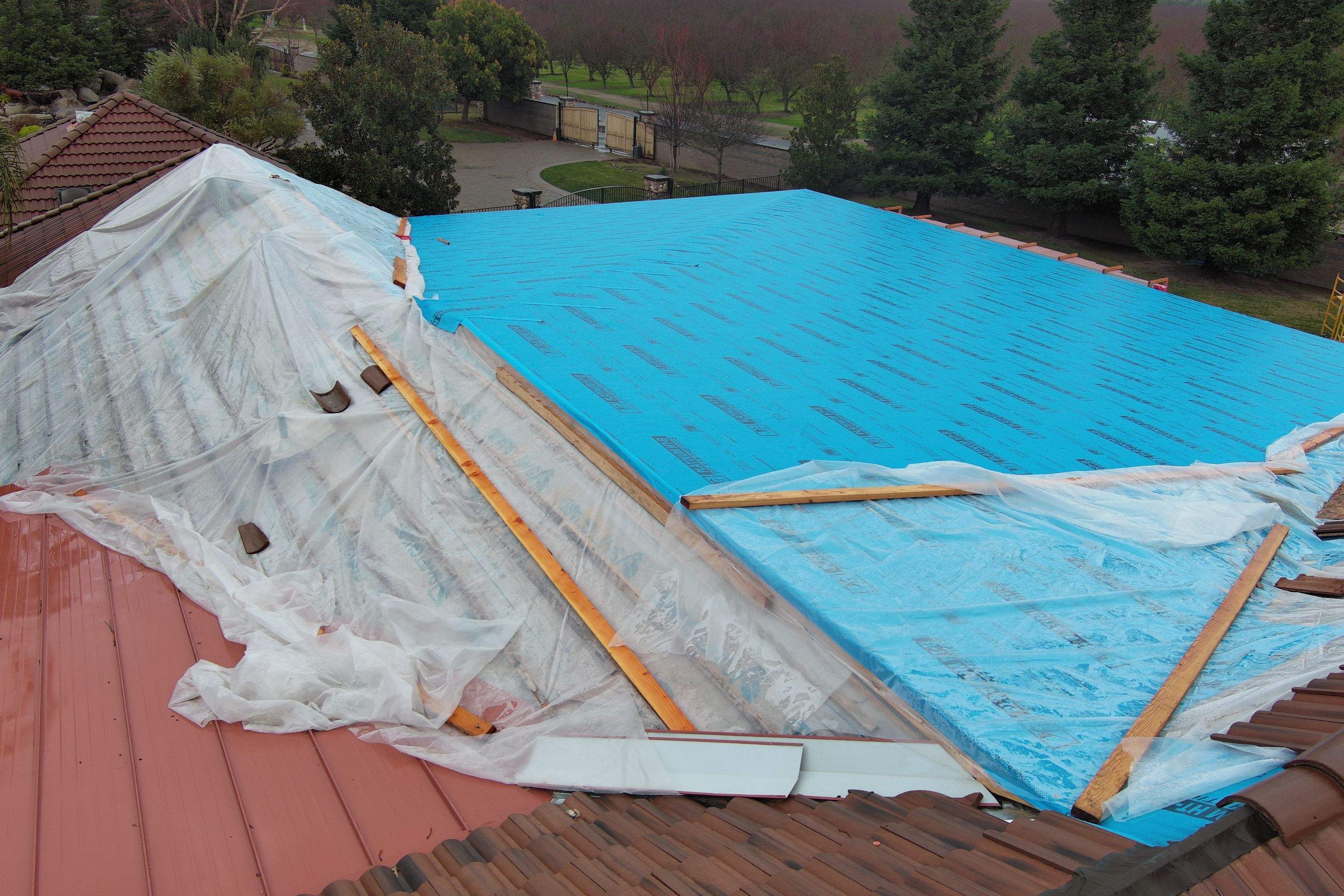 Tile, Metal, and TPO roofing project (new construction) by Straight Edge Roofing Inc