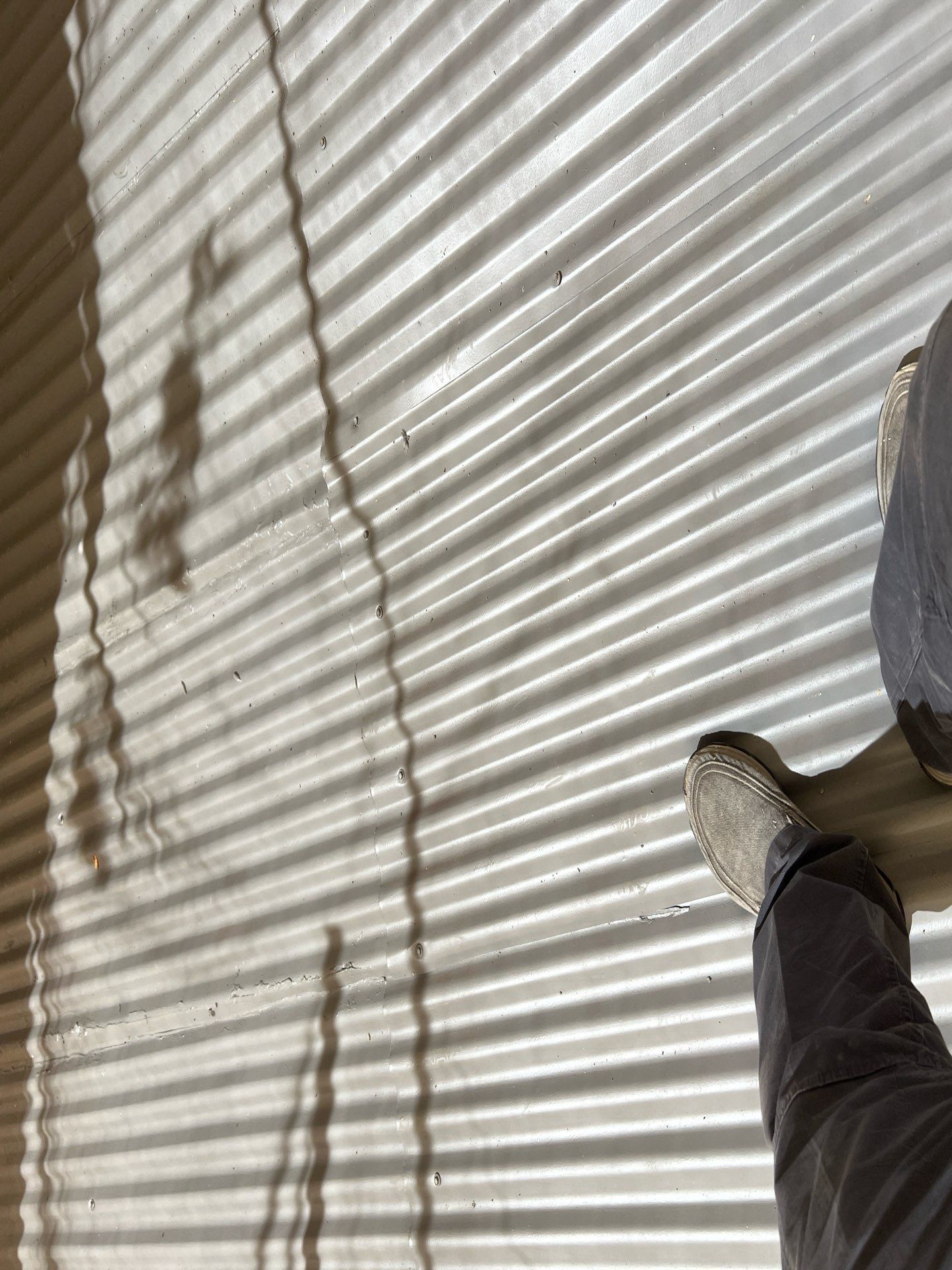 Spray foam and coatings using Conklin Benchmark/ PUMA XL acrylic coatings over metal and foam by Straight Edge Roofing Inc