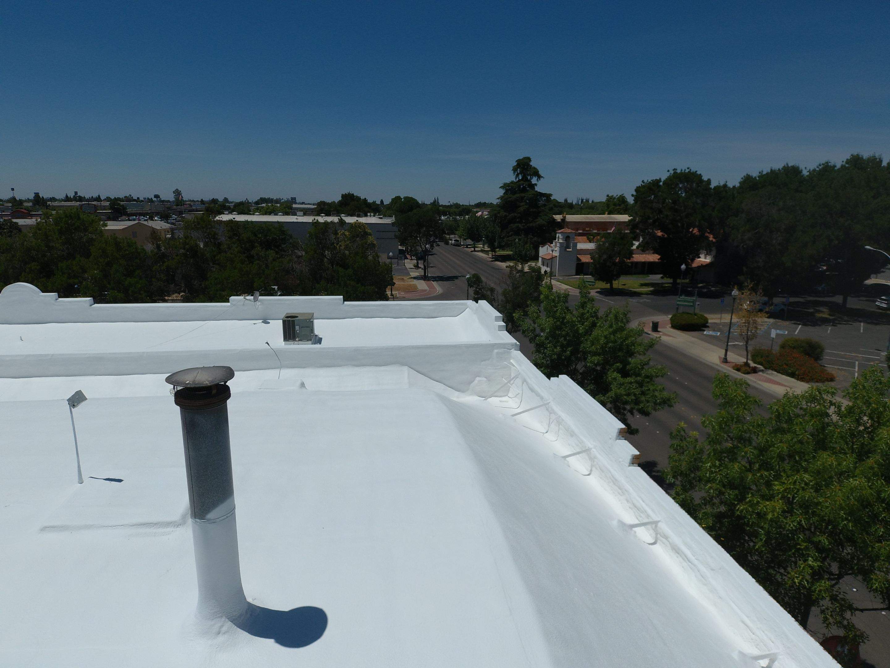 Spray foam and coatings using Conklin Benchmark/PUMA XL coatings and spray foam by Straight Edge Roofing Inc