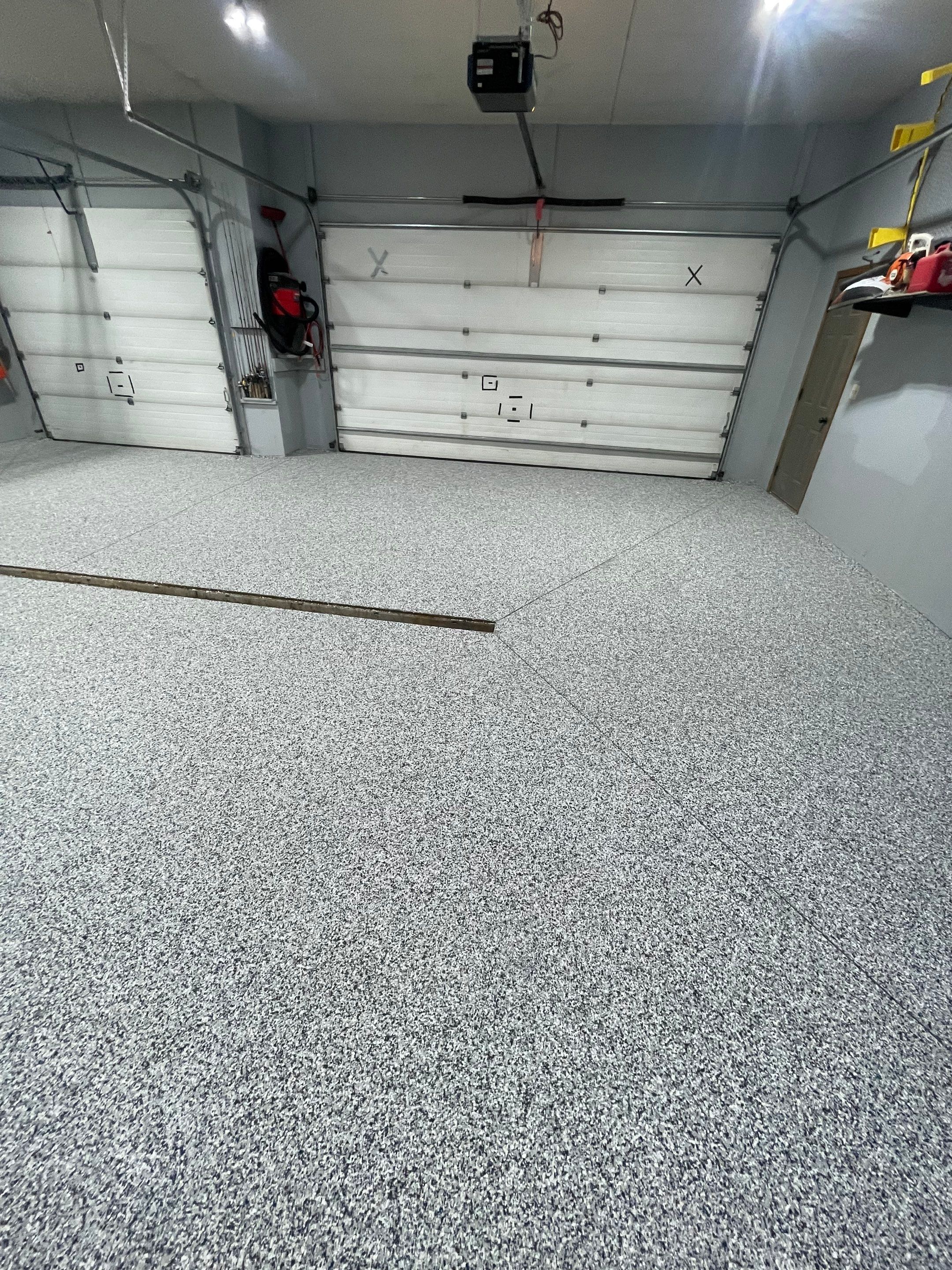 Full Garage Floor Epoxy Coating Installation in Dell Rapids by Select Painting, Coatings & Garage Cabinets