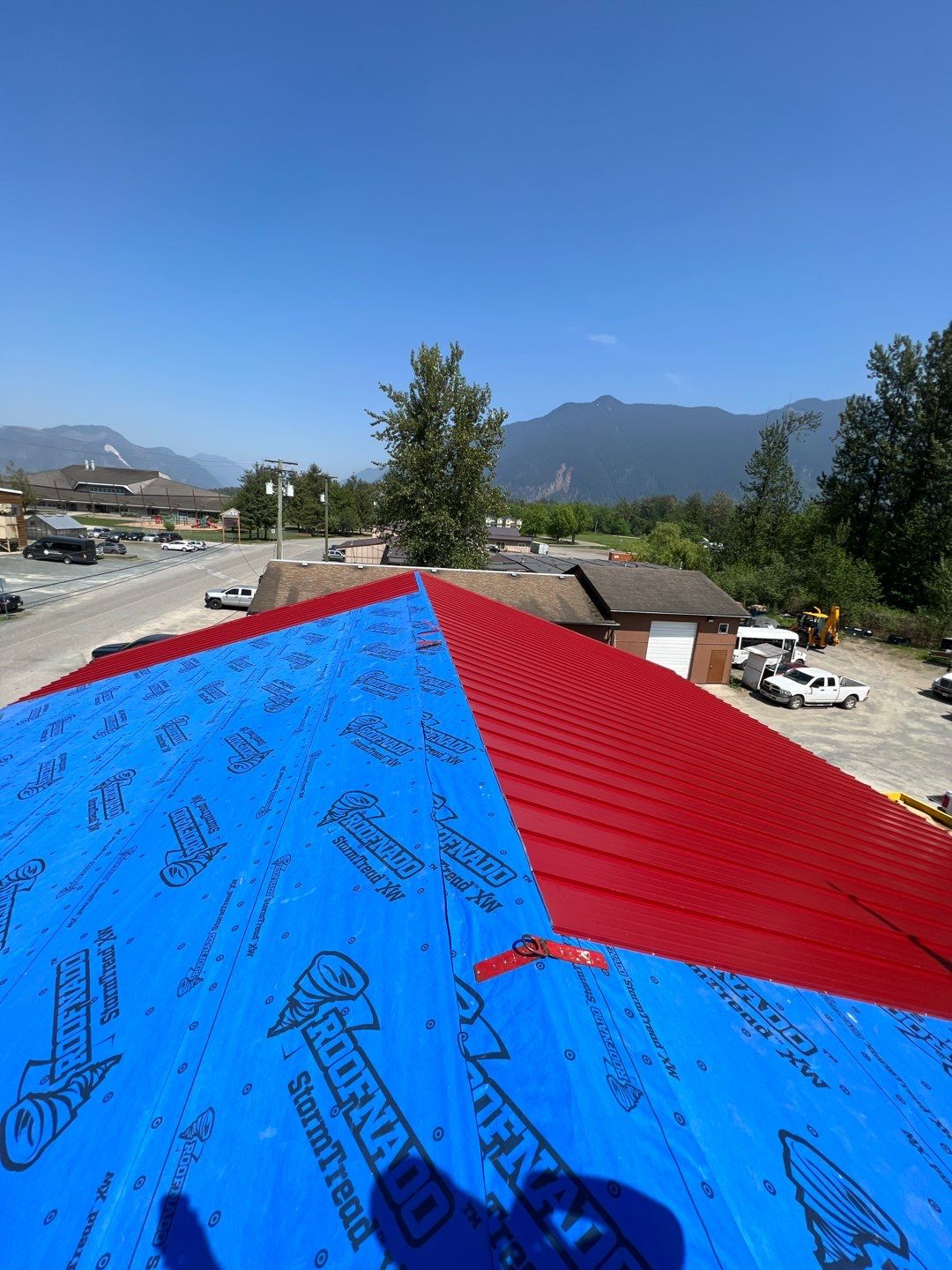 Commercial Roofing Installation using 12" Prolok metal  by Top Notch Roofing Inc