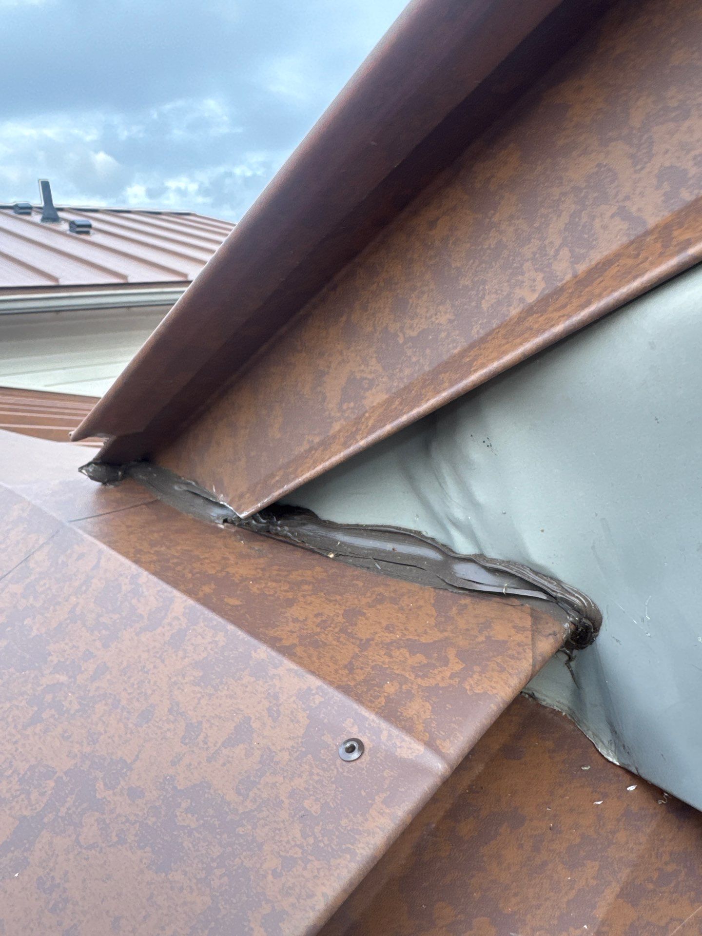 Roof Replacement using MS Standing Seam Roof Western Rust by 180 Contractors