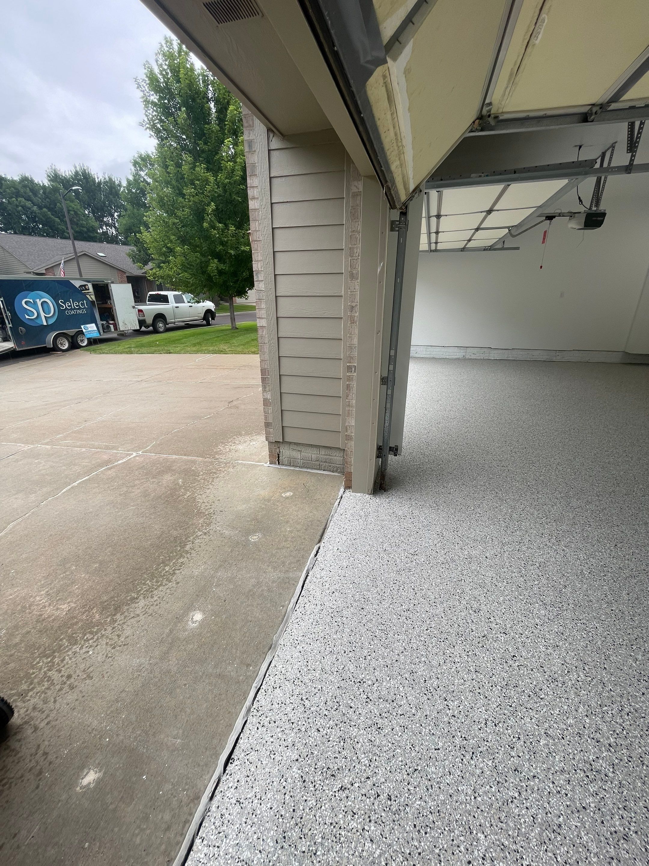 Cabin Fever Garage Floor System in Sioux Falls by Select Painting, Coatings & Garage Cabinets
