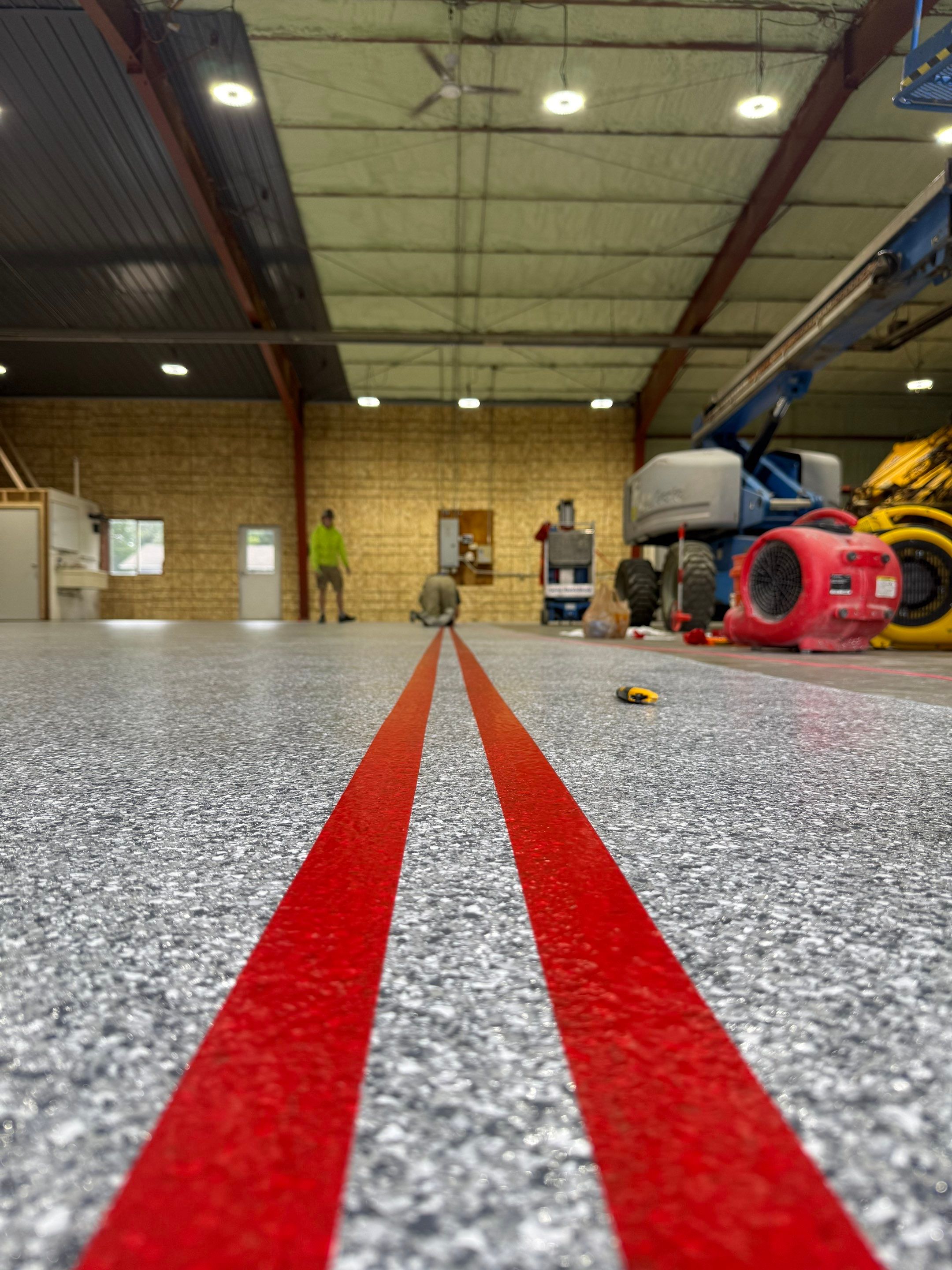 Custom Polyurea Shop Floor with Basketball Court Lines in Rock Valley by Select Painting, Coatings & Garage Cabinets