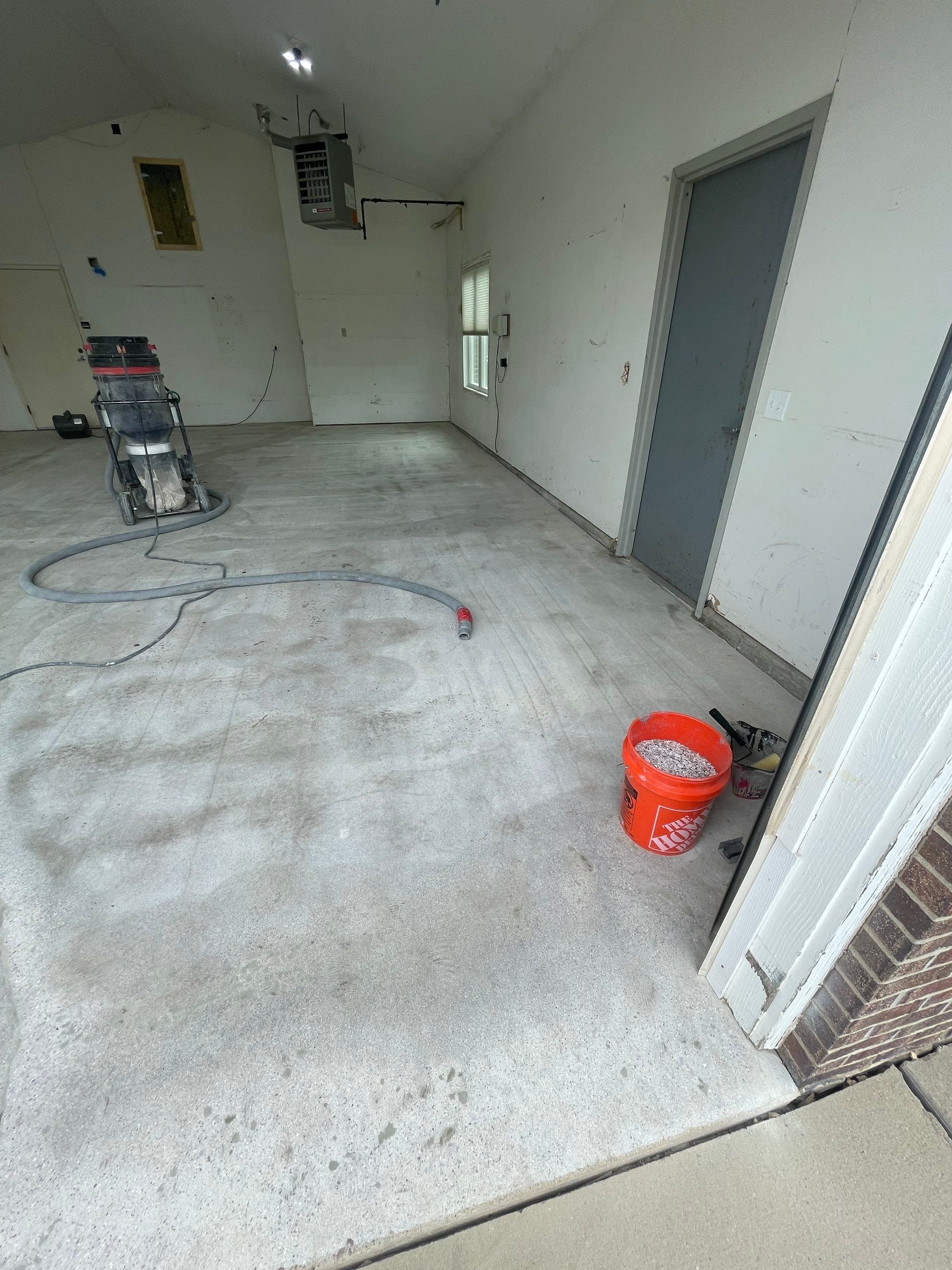 Coyote Flake Concrete Coating for Sioux Falls Garage by Select Painting, Coatings & Garage Cabinets