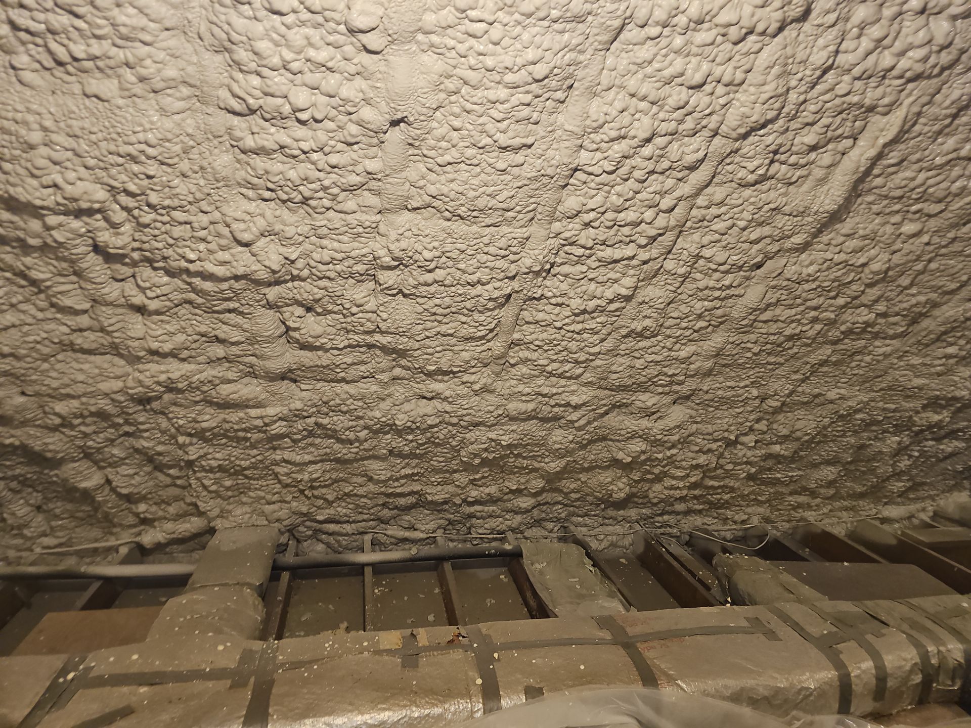 Attic Retrofit using open cell spray foam by NYS Foam & Energy