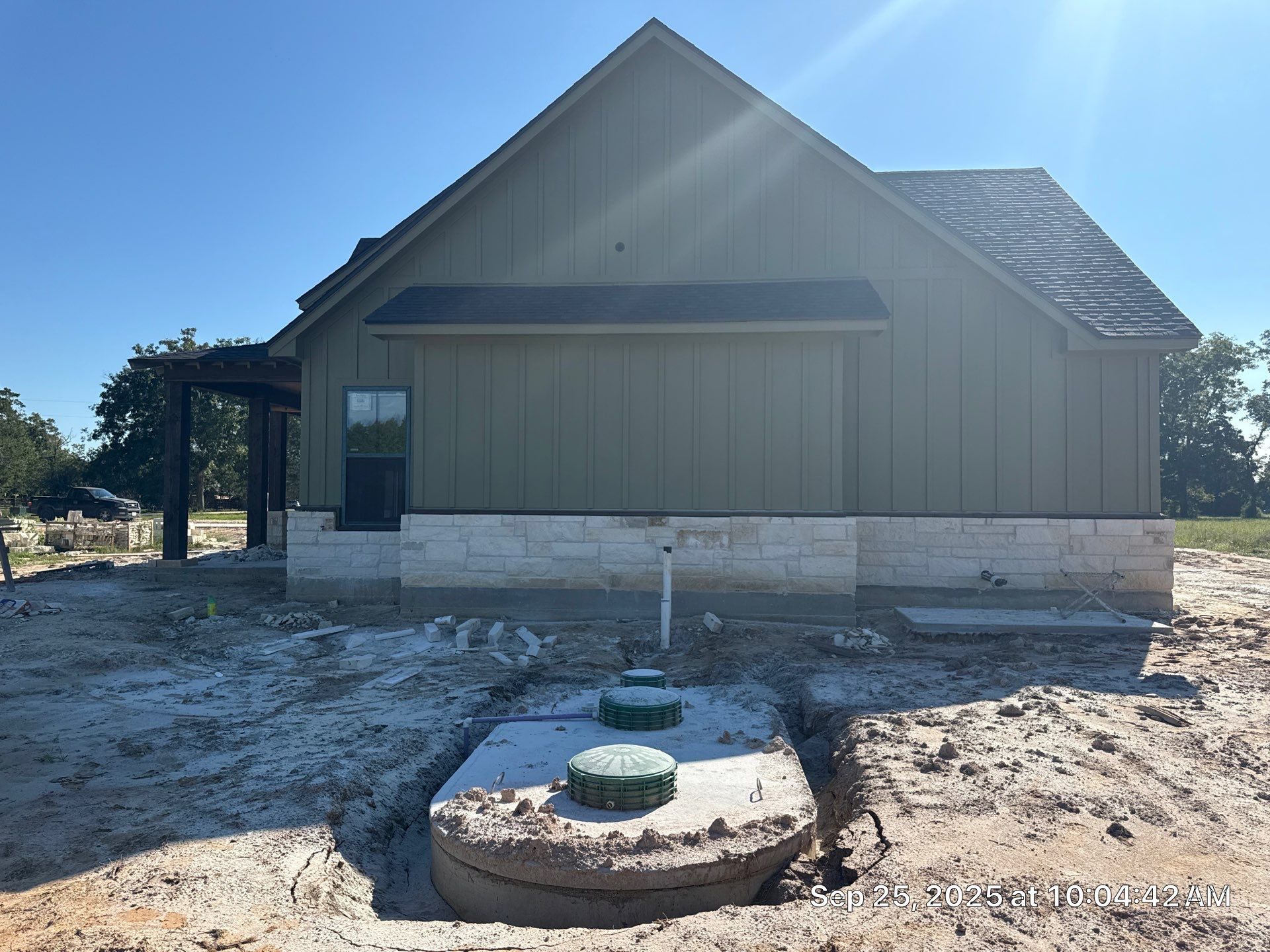 Cleveland Ranch Charm: Natural Stone Wainscot with Green Accent Siding. by Apex Conventional Stucco Llc