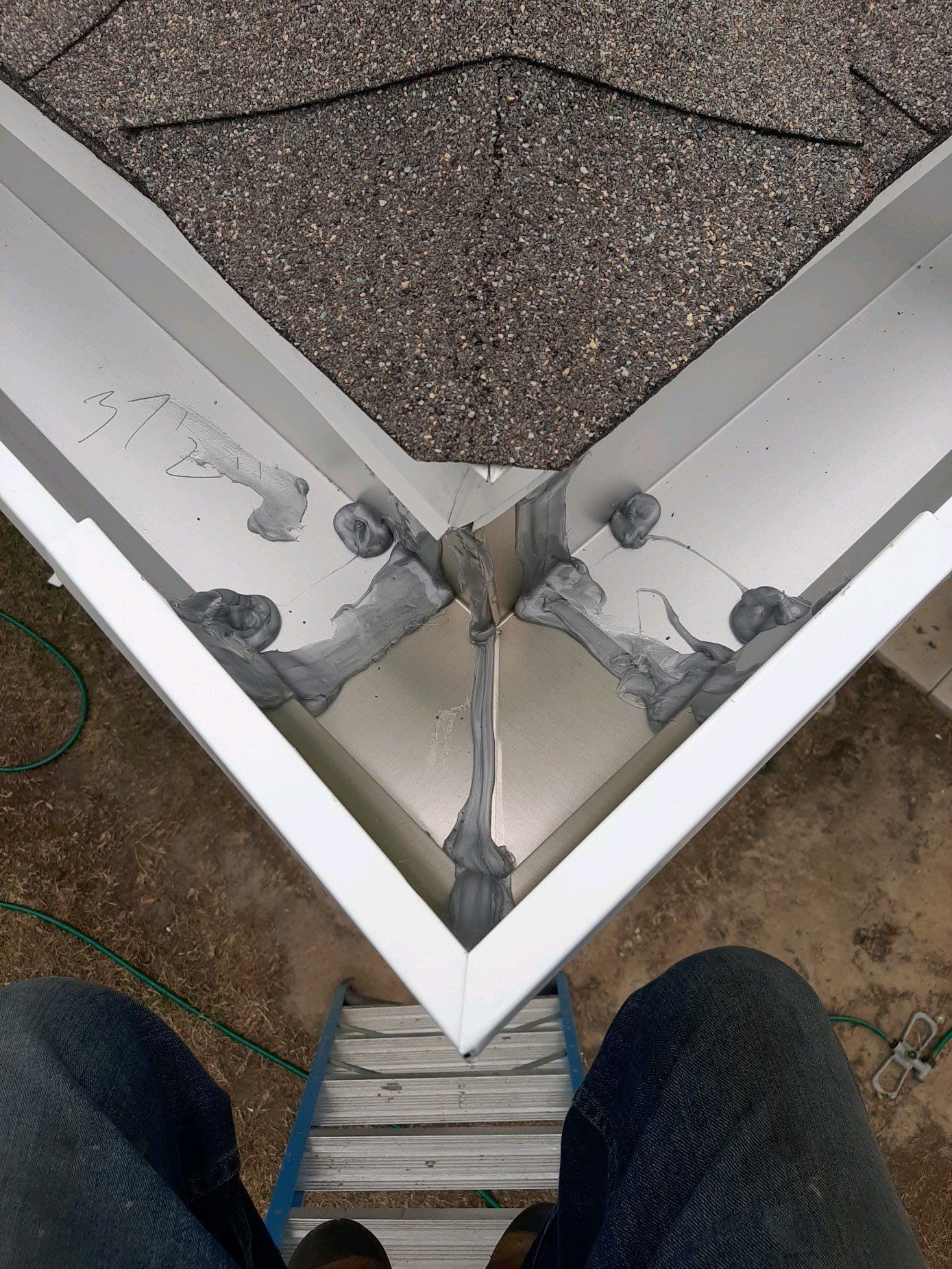 Seamless Gutter Installation Using White 6 Inch Gutters by Gutter Professors
