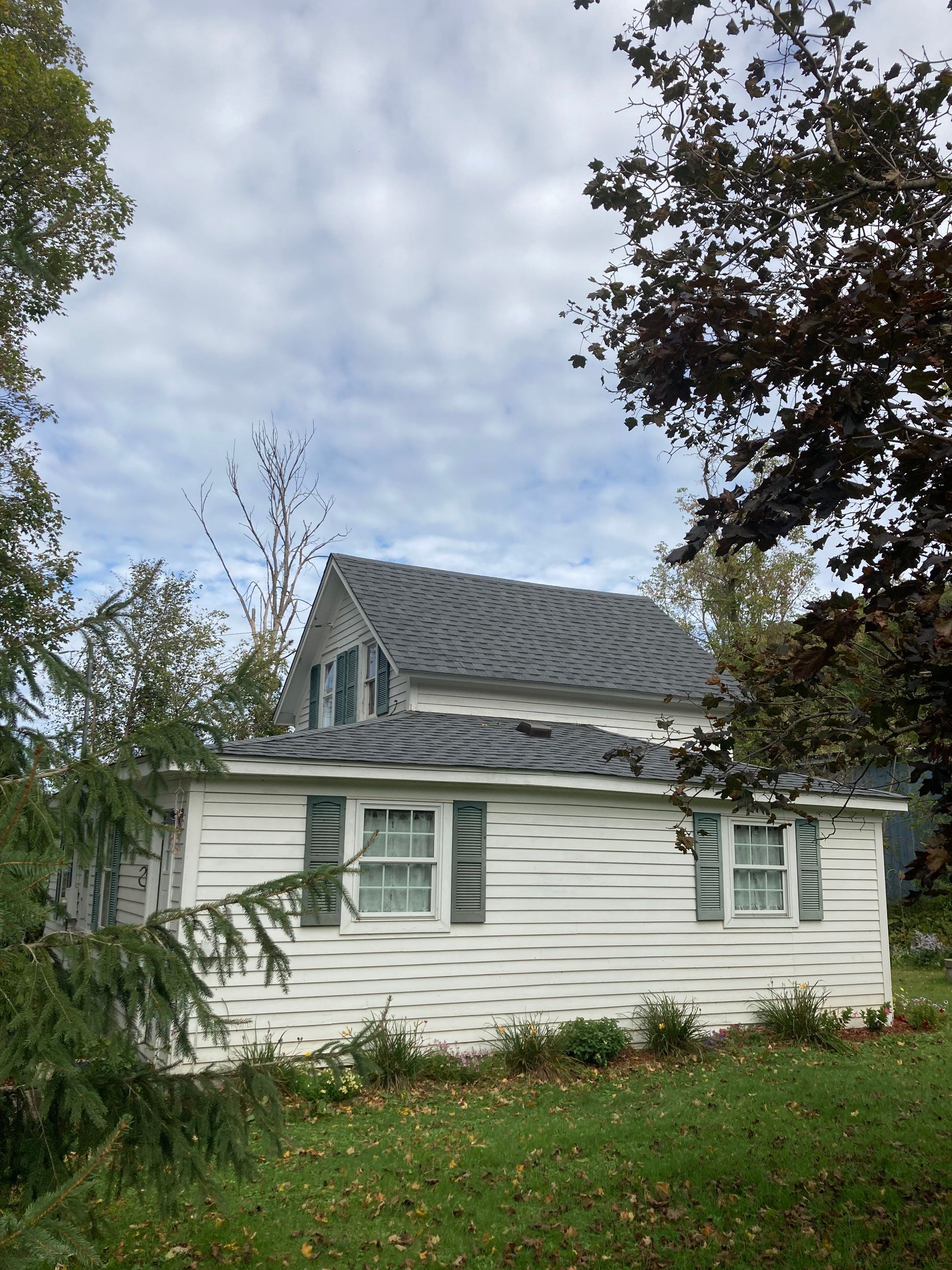 roof replacement on a garage and home by Reasonable Contracting LLC