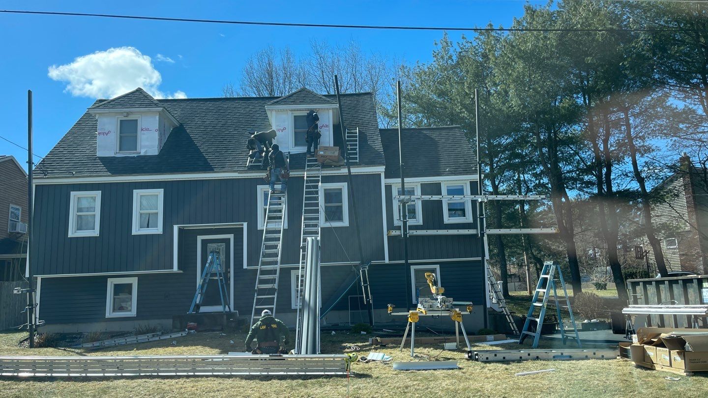 Complete Exterior Renovation with New Siding & Gutters   by Sensible Home Solutions
