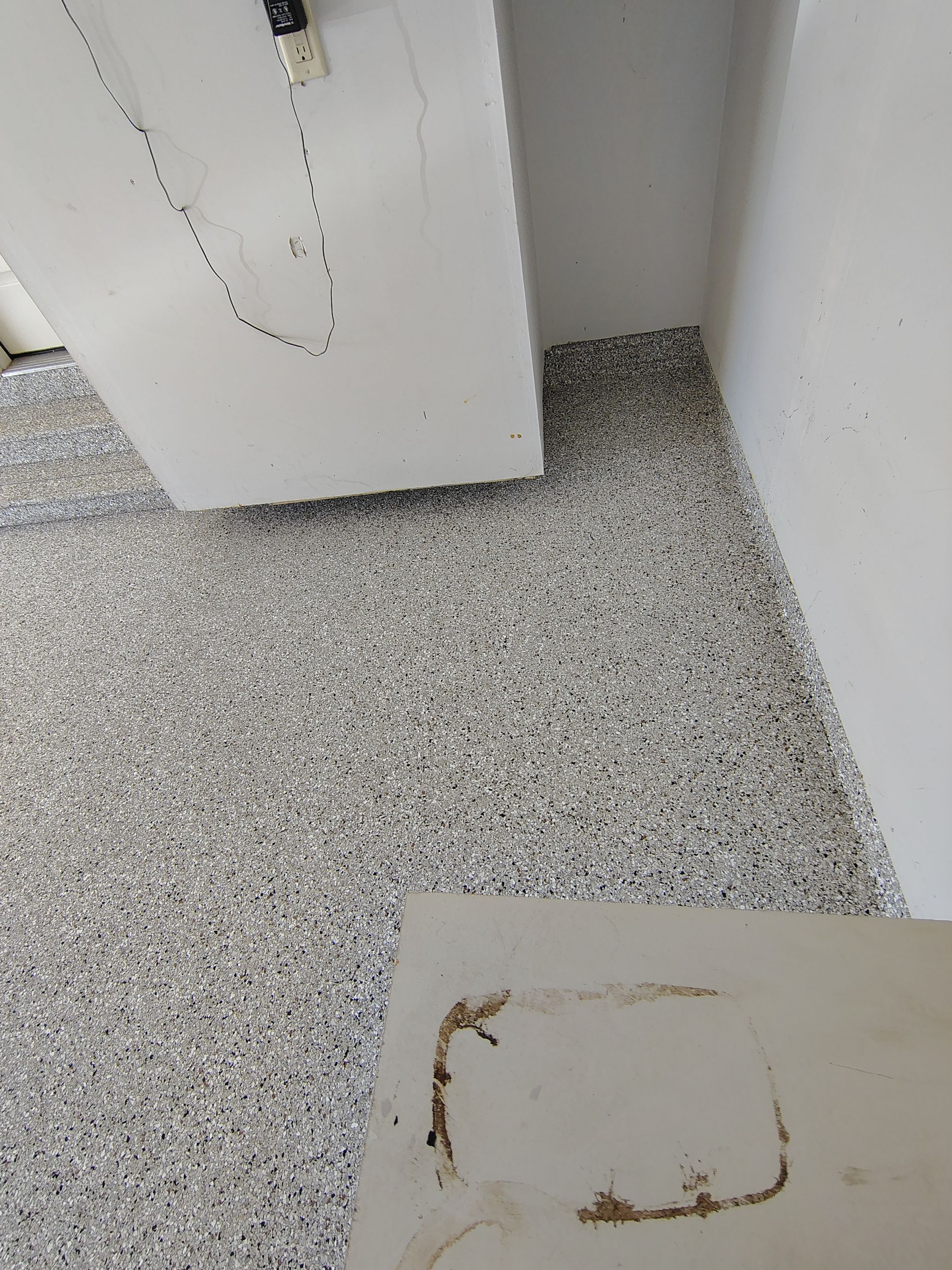 Decorative Chip Epoxy Garage Floor Coating in Sioux Falls by Select Painting, Coatings & Garage Cabinets