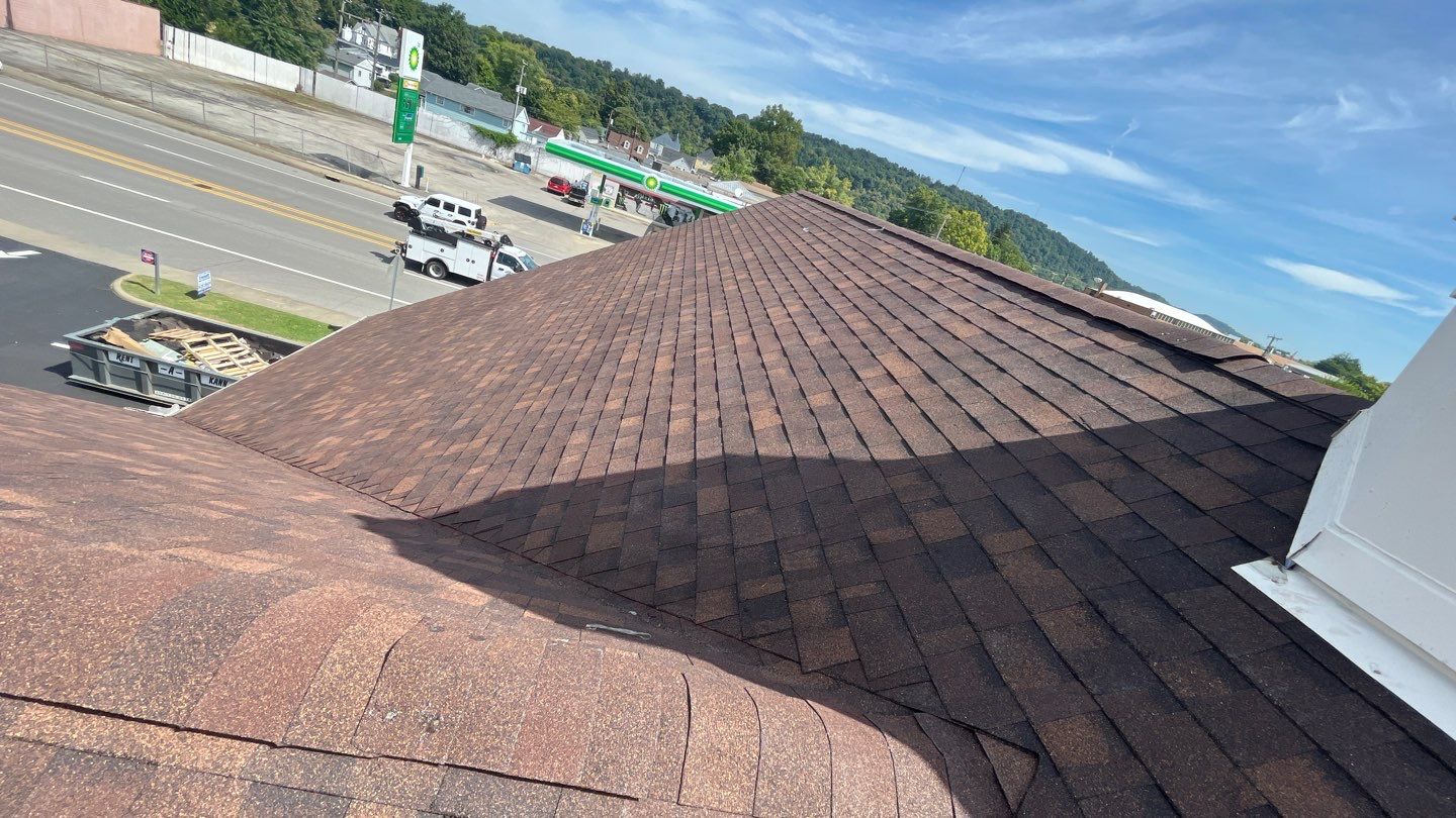 Commercial Roofing Installation using Performance Shingles by Mr. Roofer