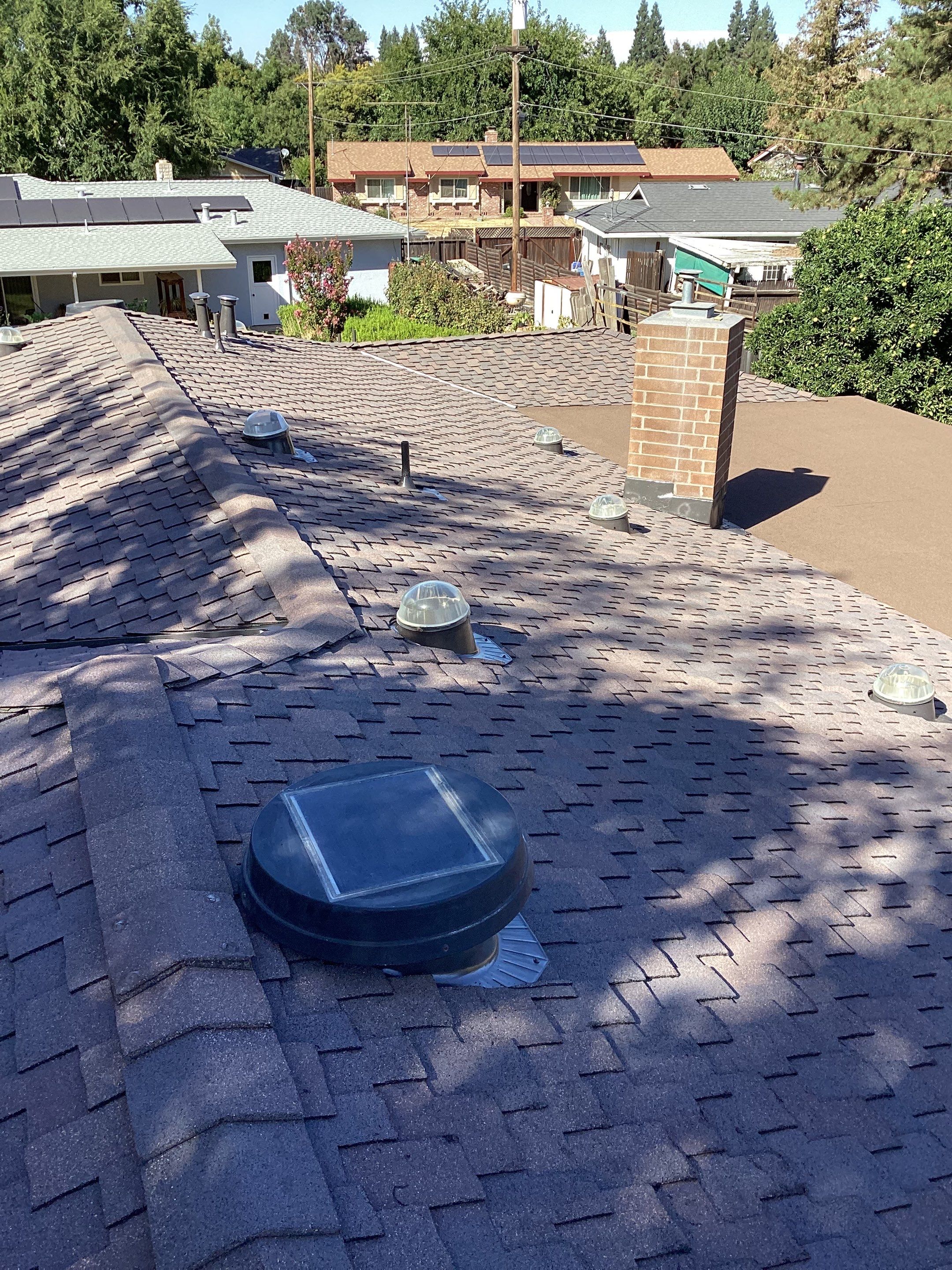 Installation of Certainteed Presidential shingles on residential house by Straight Edge Roofing Inc
