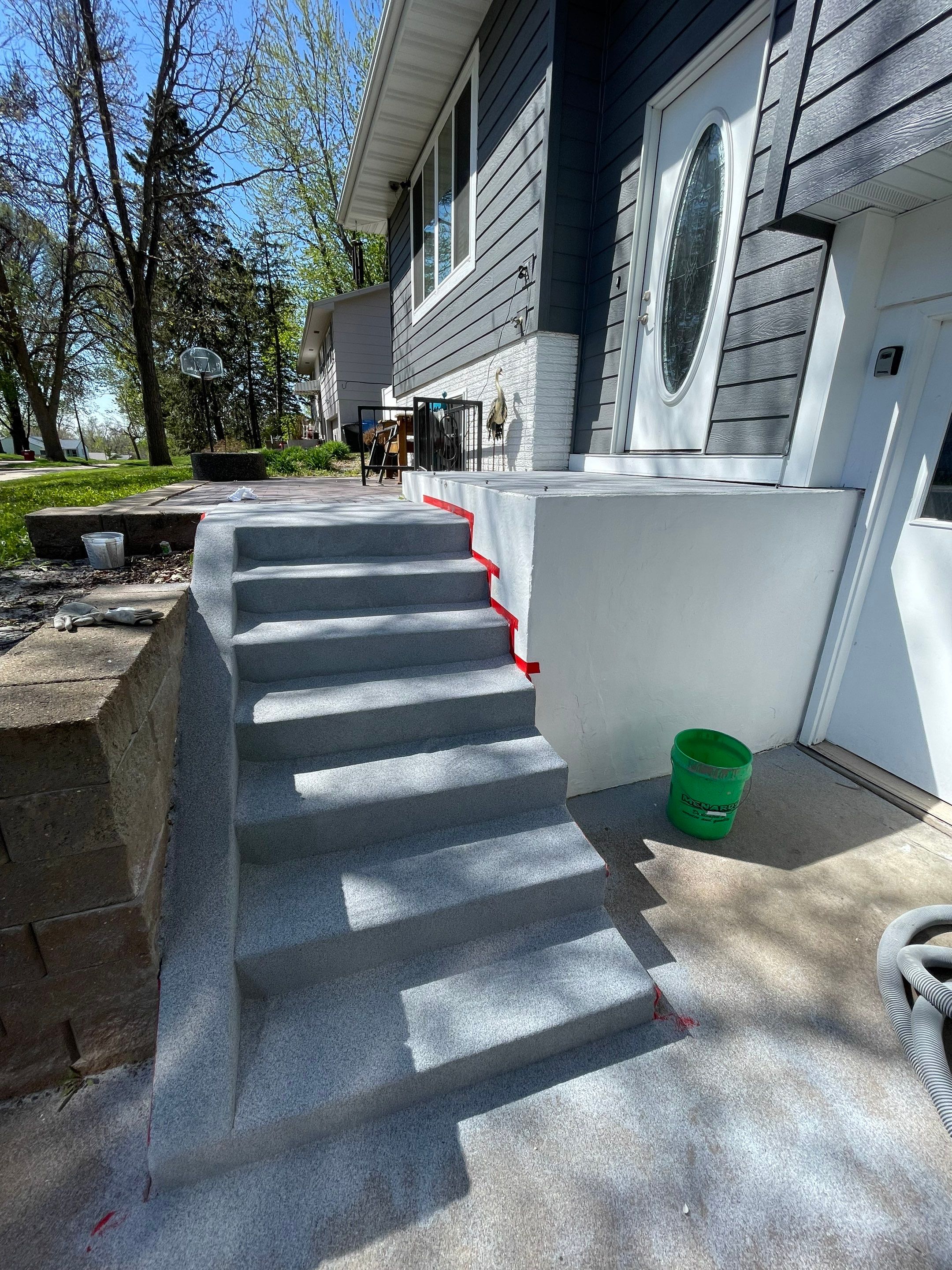Grey Polyaspartic Porch and Stair Resurfacing in Sioux Falls by Select Painting, Coatings & Garage Cabinets