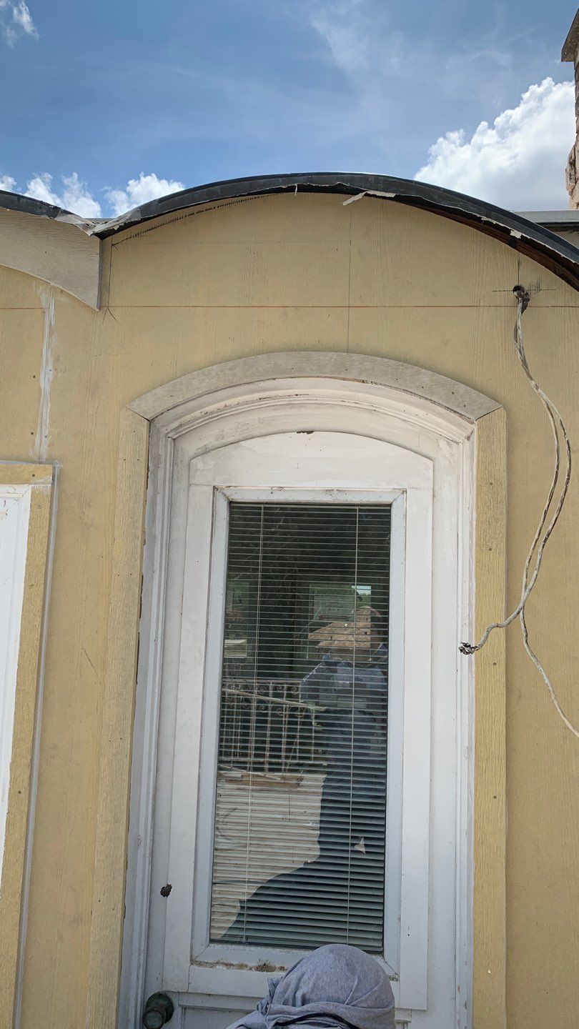 Mansard Charm by Bayfront Roofing and Construction
