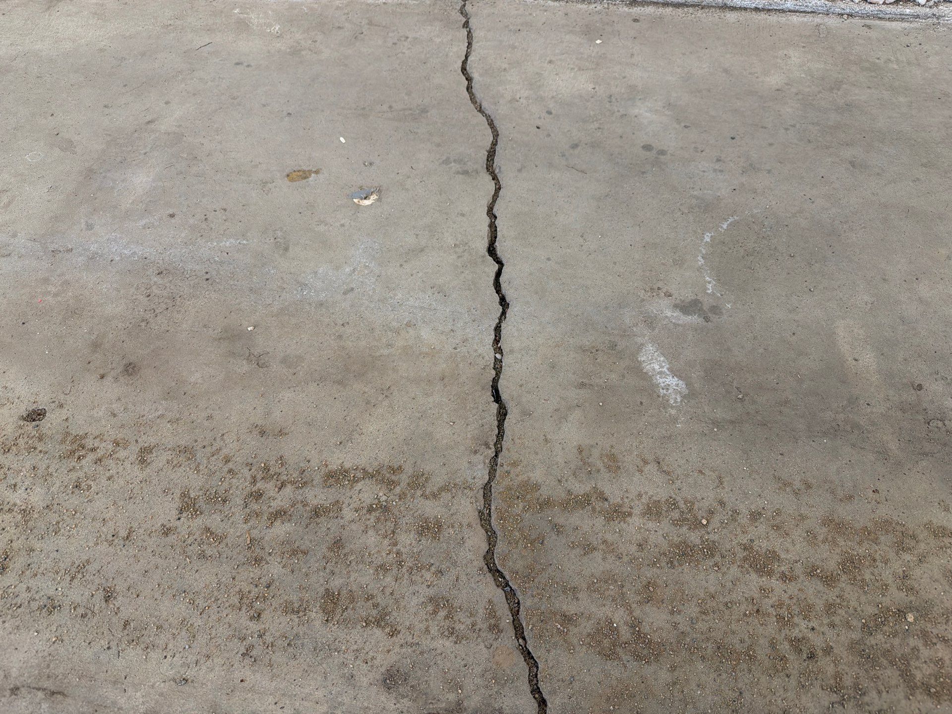 Feather Grey Garage Floor Coating and Crack Repair in Beresford by Select Painting, Coatings & Garage Cabinets