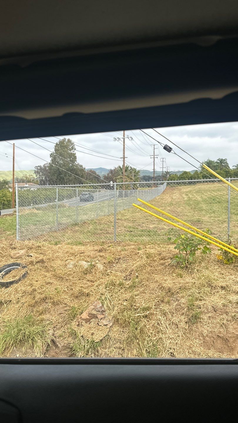Fence installation using chain link wire by Fence Guys Inc. 