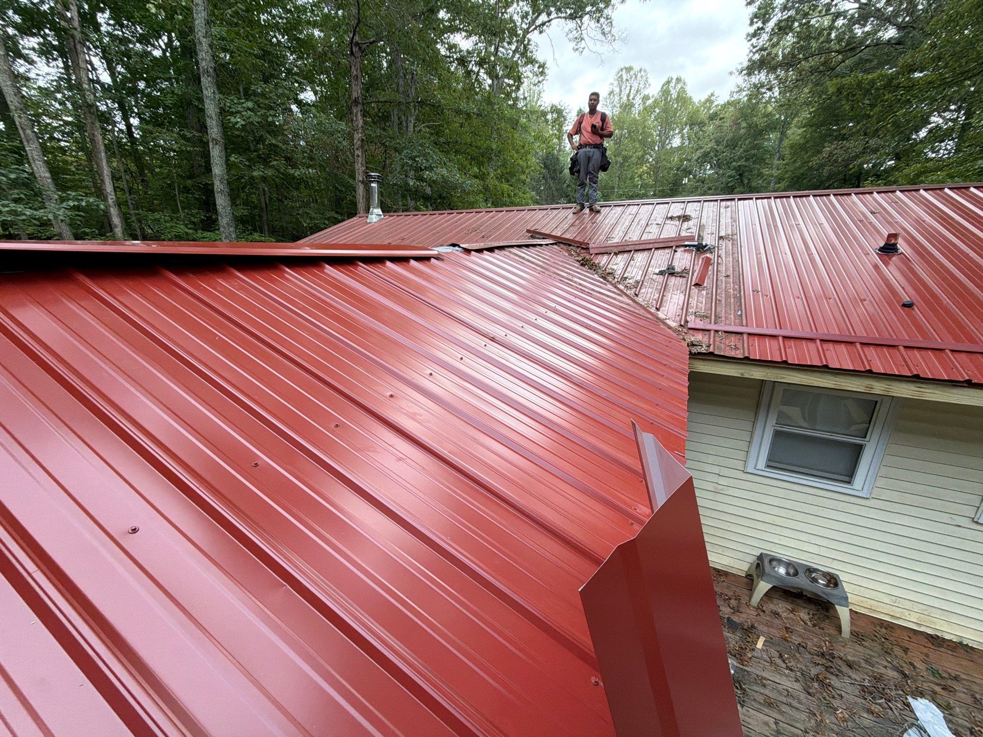 Red Metal Roof Restoration and Wood Fascia Replacement in Barboursville by Cade Construction