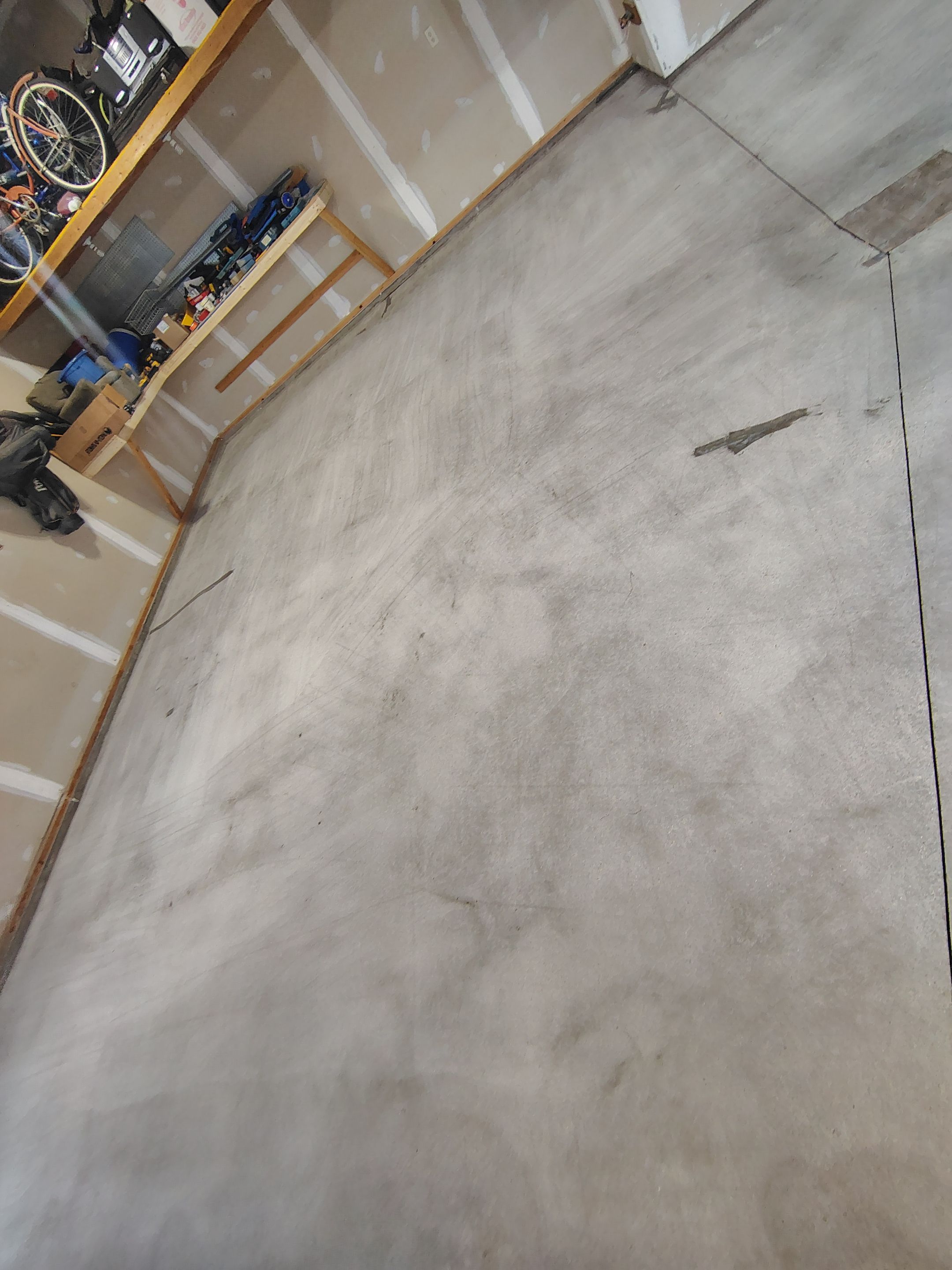 Sioux Falls Garage Concrete Grinding and Nightfall Decorative Chip Coating by Select Painting, Coatings & Garage Cabinets