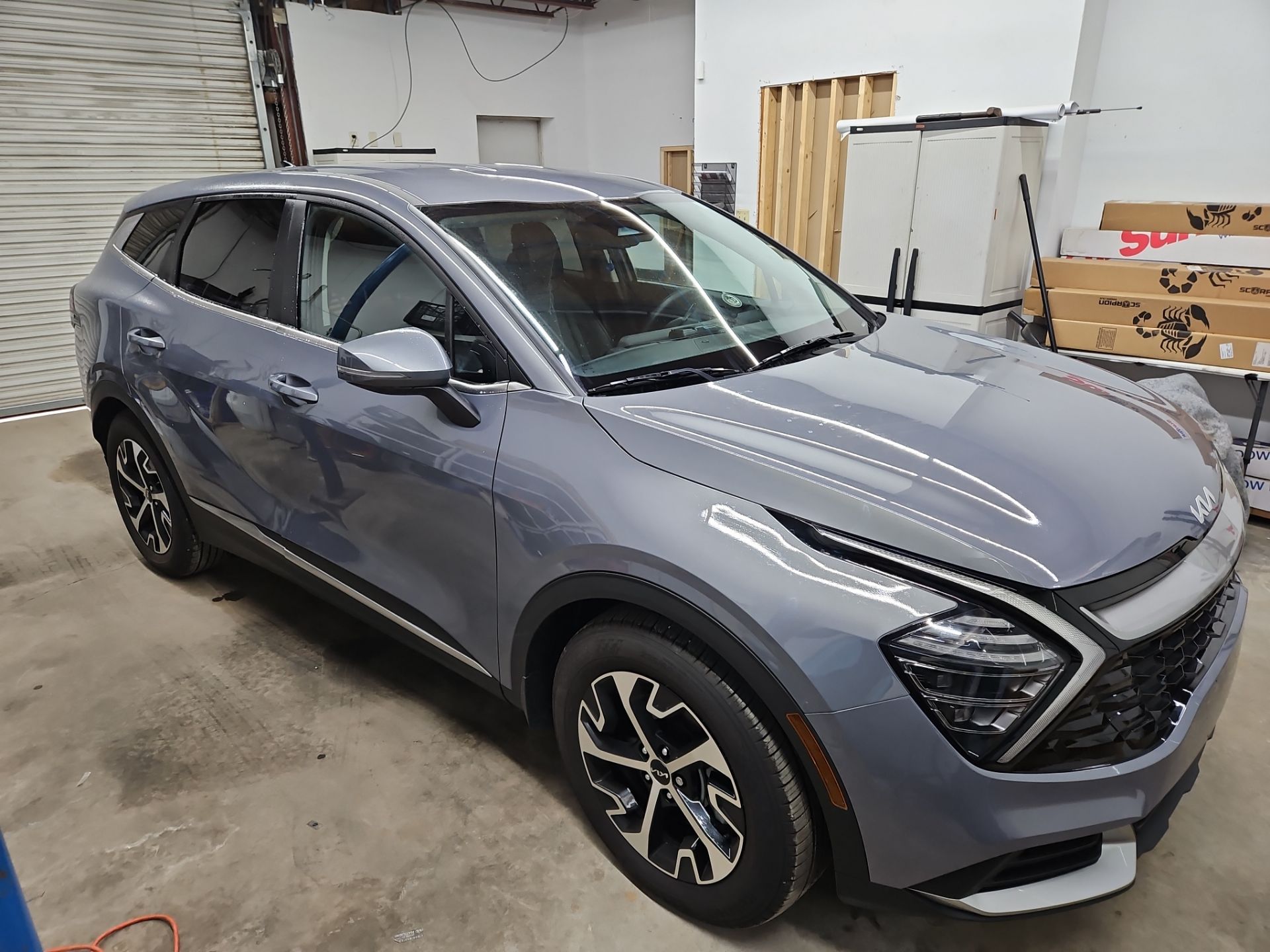 the image shows a vehicle that is being prepared for window tinting by t's window tinting the car is a modern suv with a sleek design and has a light gray exterior the service involves applying a tinted film to the windows which enhances privacy and reduces heat inside the vehicle the interior is likely being cleaned and checked to ensure a smooth application of the tint the overall process is aimed at improving comfort and aesthetics of the car