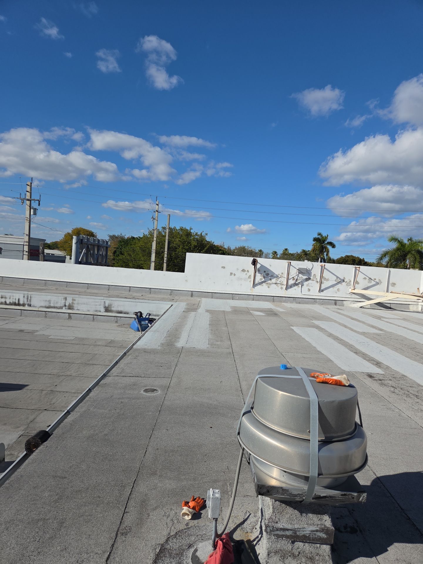 Commercial Flat Roof Restoration Using Silicone Coating in Hallandale Beach by Aastro Roofing