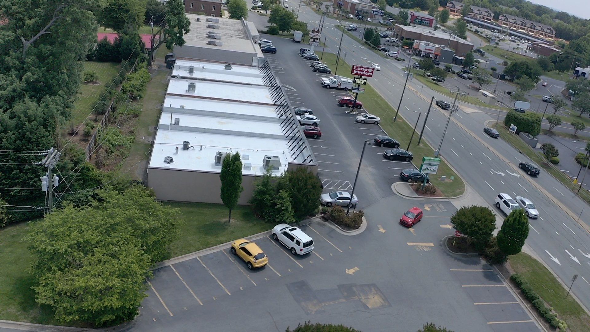 Commercial Roof Coating using Fiberseal basecoat and Silicon Topcoat by Just In Time Roofing and Restoration