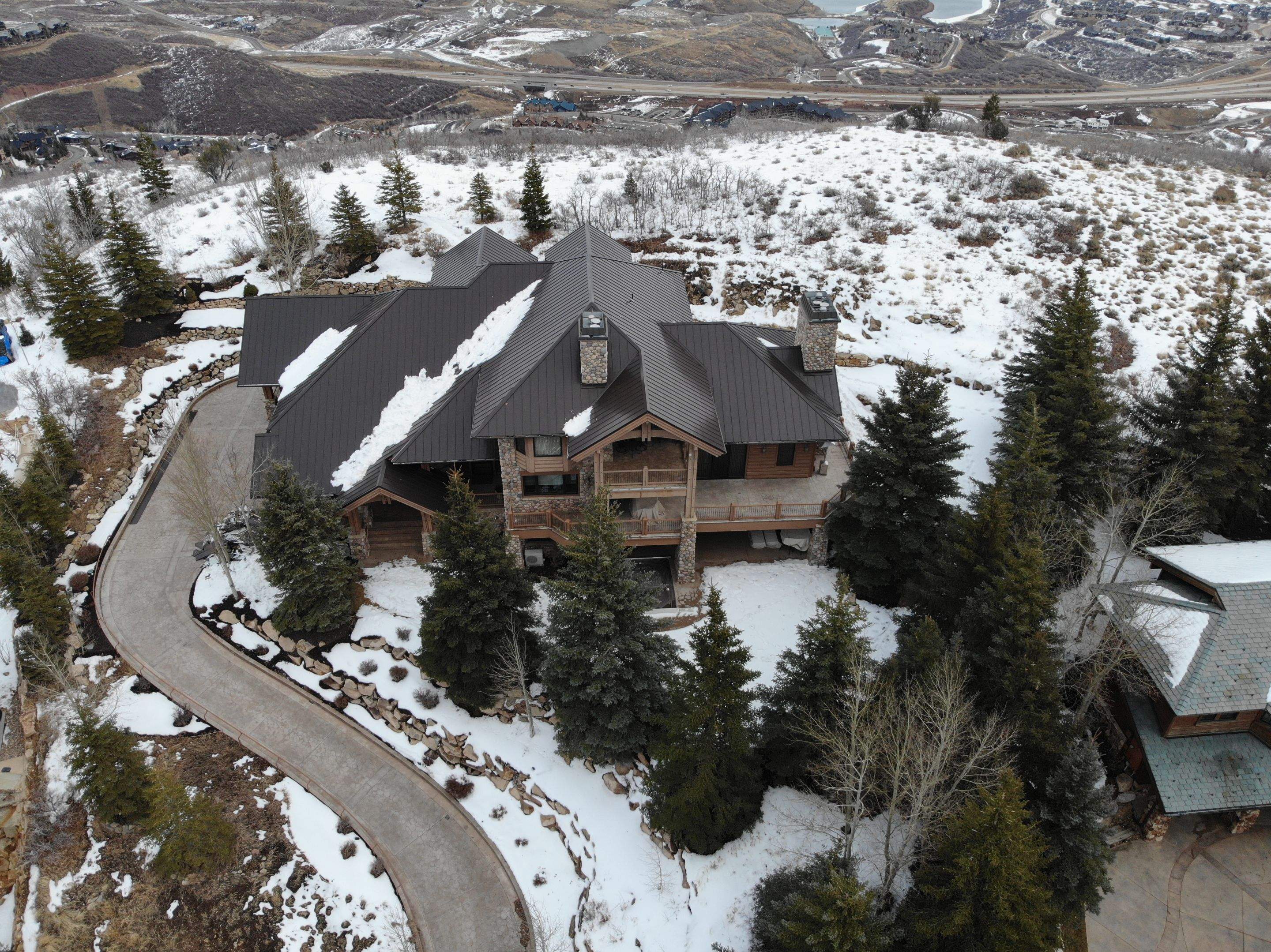 Standing Seam Metal Roof Replacement After Snow Damage by ASAP Roofing & Restoration