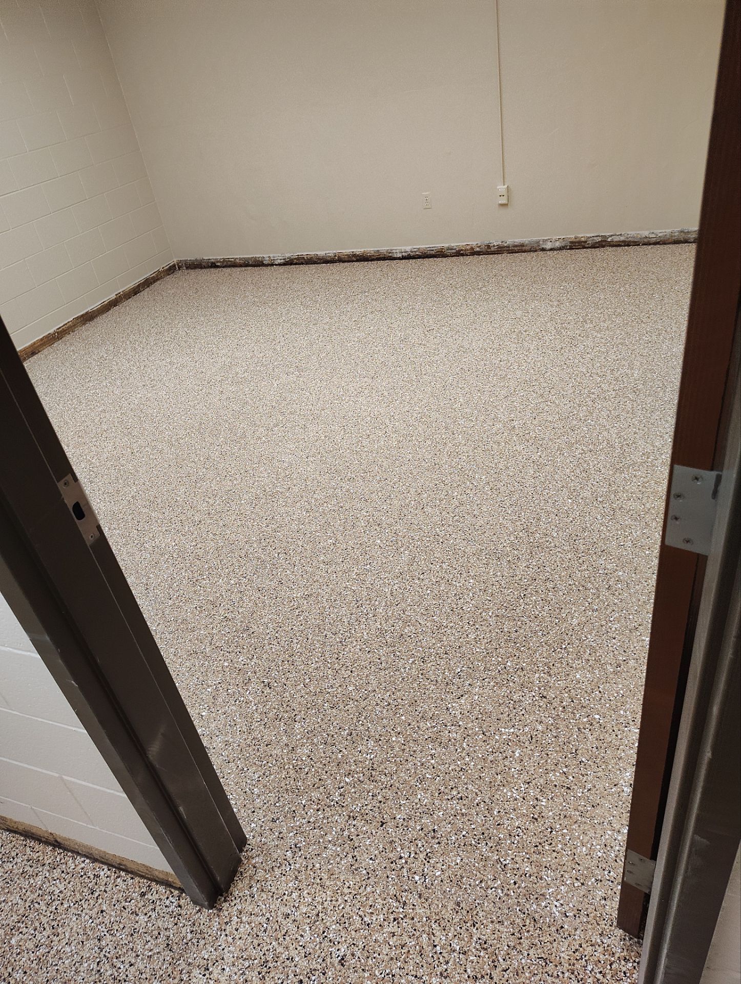 Industrial Flake Epoxy Floor Installation at Pierre National Guard Facility by Select Painting, Coatings & Garage Cabinets