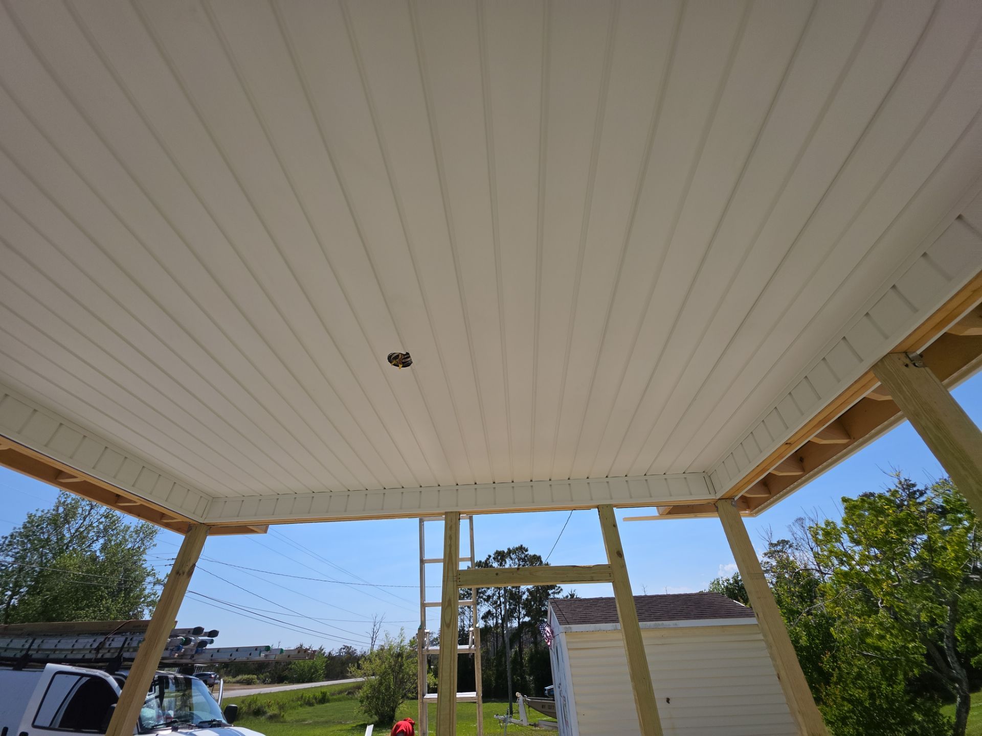 Custom Screened Porch and Deck Addition in Sea Level by The Remodeling Company