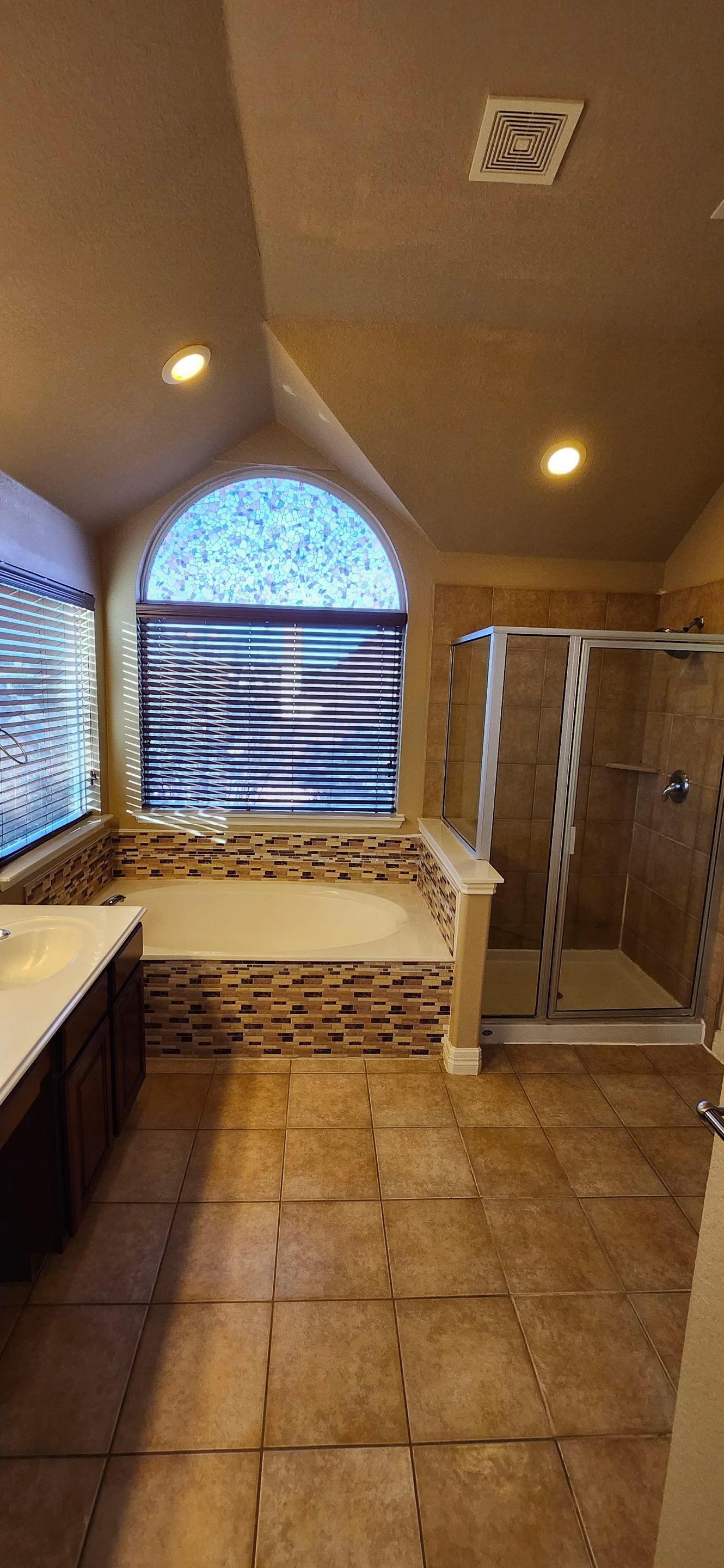 Stone Oak Bathroom Remodel with Freestanding Tub & Walk-In Shower by Legacy Bath and Kitchen
