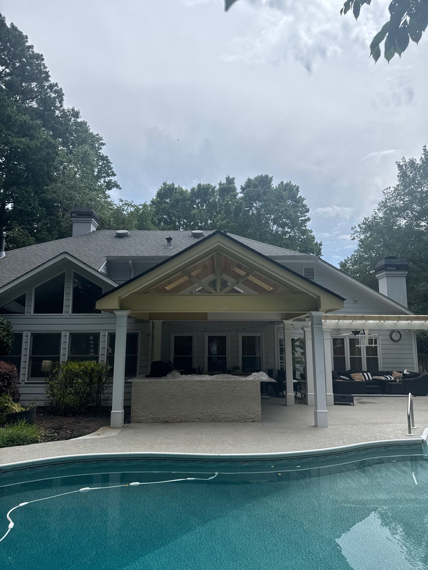 Marietta Poolside Pavilion with Custom Outdoor Kitchen and Pergola by Swift Home Renovations