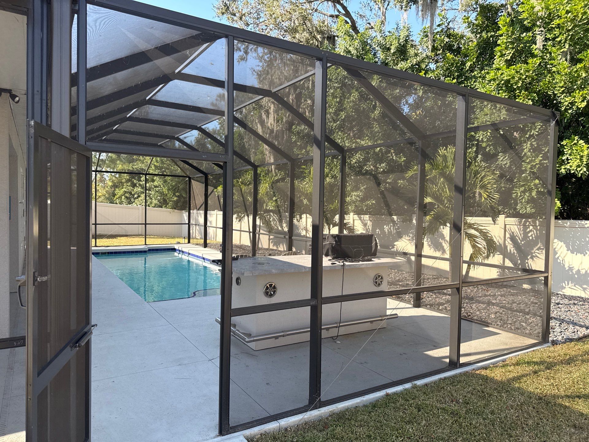 Painted Pool Deck & Screen Enclosure Cleaning | Heron Creek, Palmetto FL by Sunshine AquaWash