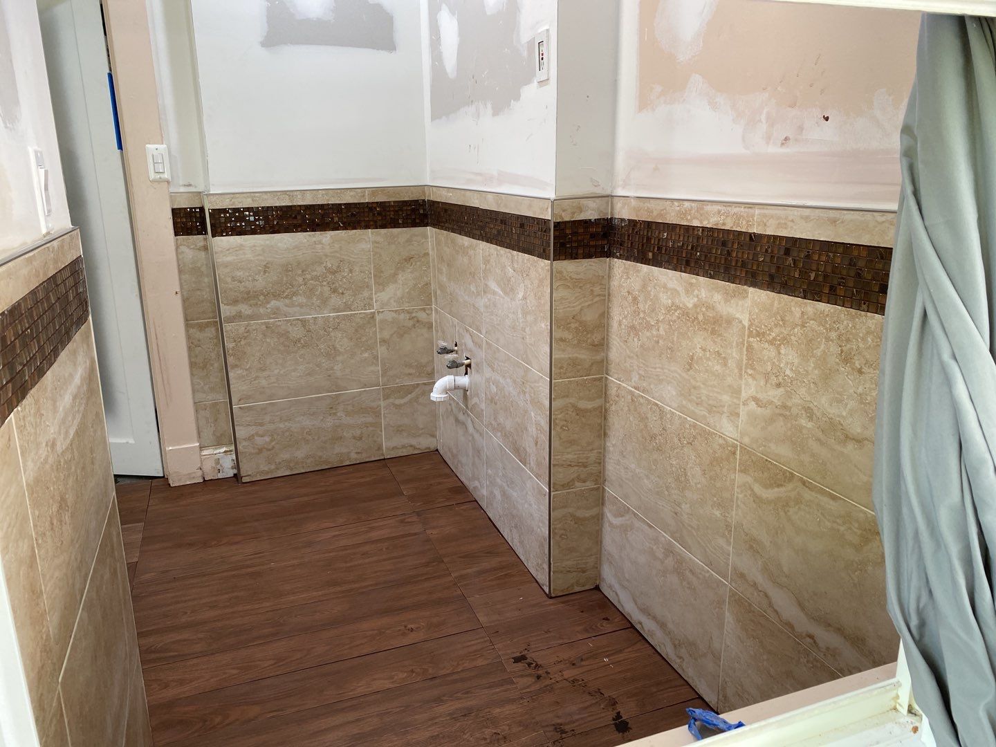 Bathroom Remodel using New Bathroom Tile and Tube by Alpha Design Services