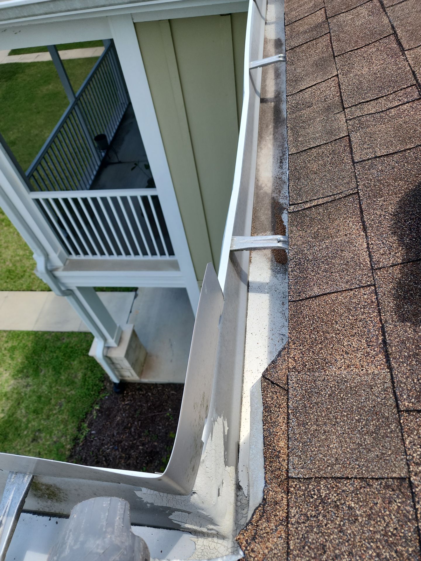 HOA gutter cleaning in Port Charlotte, FL, after  photo showing full gutters.