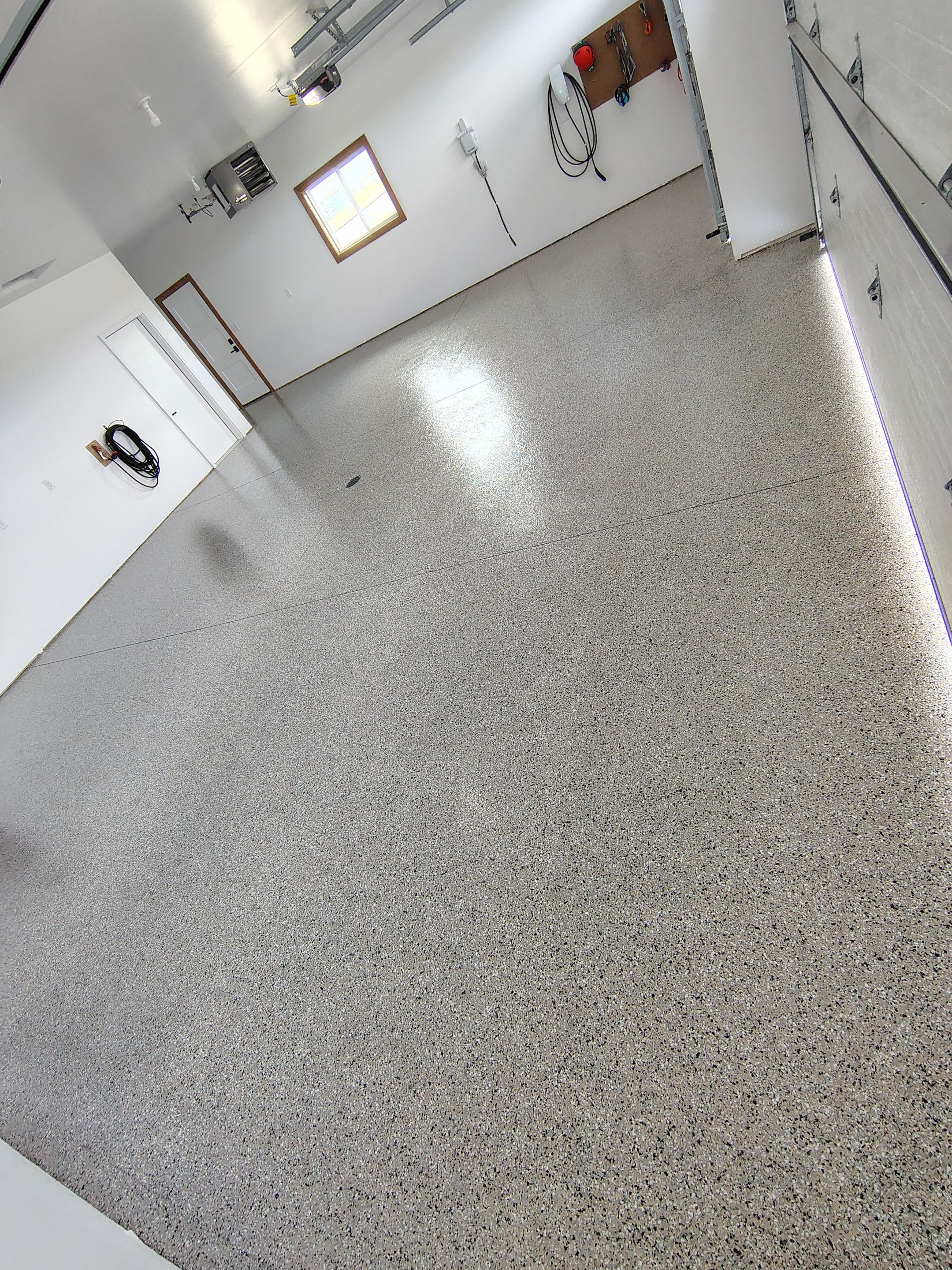Gray and White Speckled Epoxy Garage Floor Coating in Tea by Select Painting, Coatings & Garage Cabinets