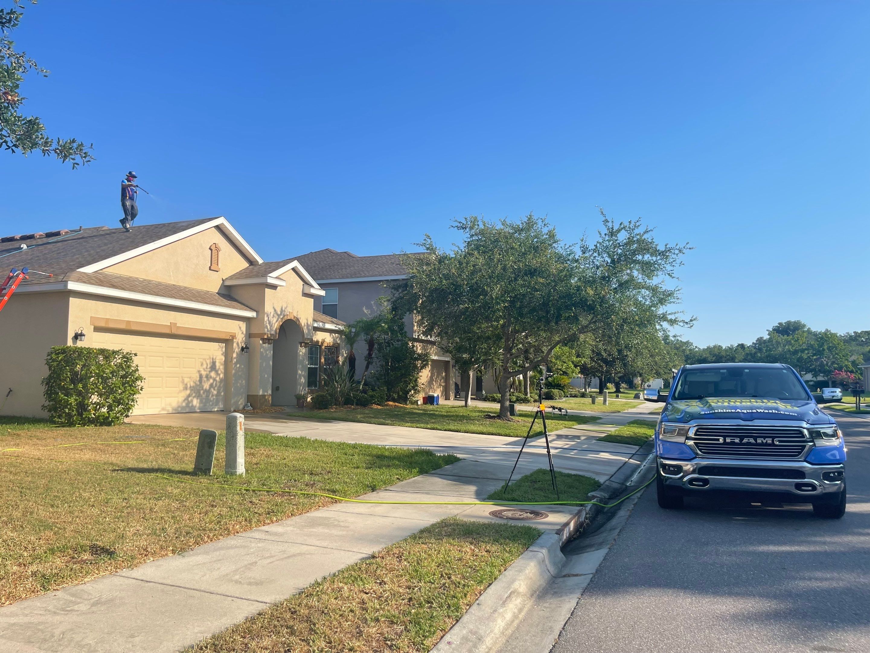 Asphalt Shingle Roof Soft Wash Cleaning & Concrete Pressure Washing in CopperStone Community, Parrish, FL by Sunshine AquaWash