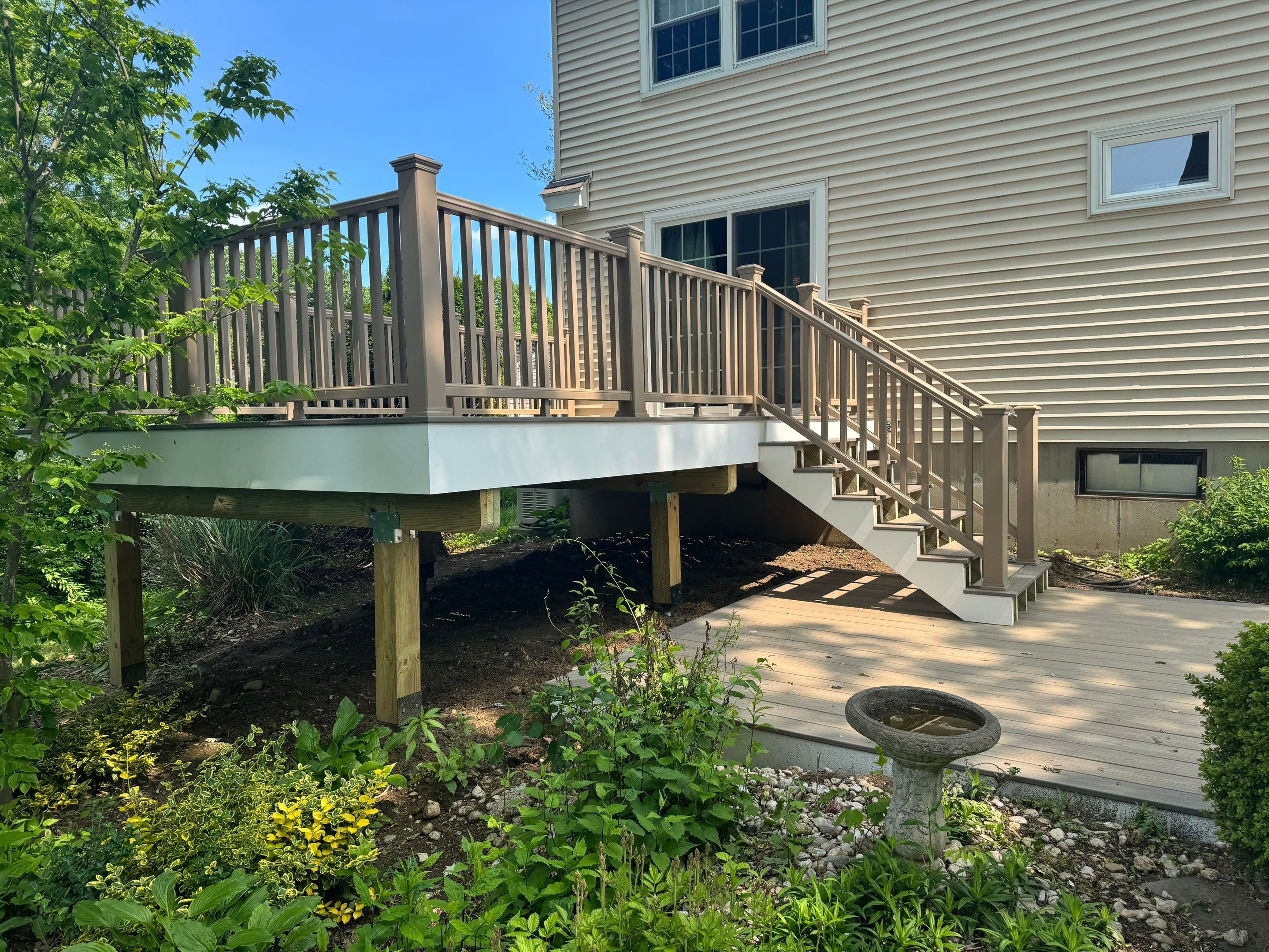 Deck replacement using Trex Transcend Rope Swing and Matching Rope Swing Transcend railing by DiGiorgi Roofing and Siding Inc