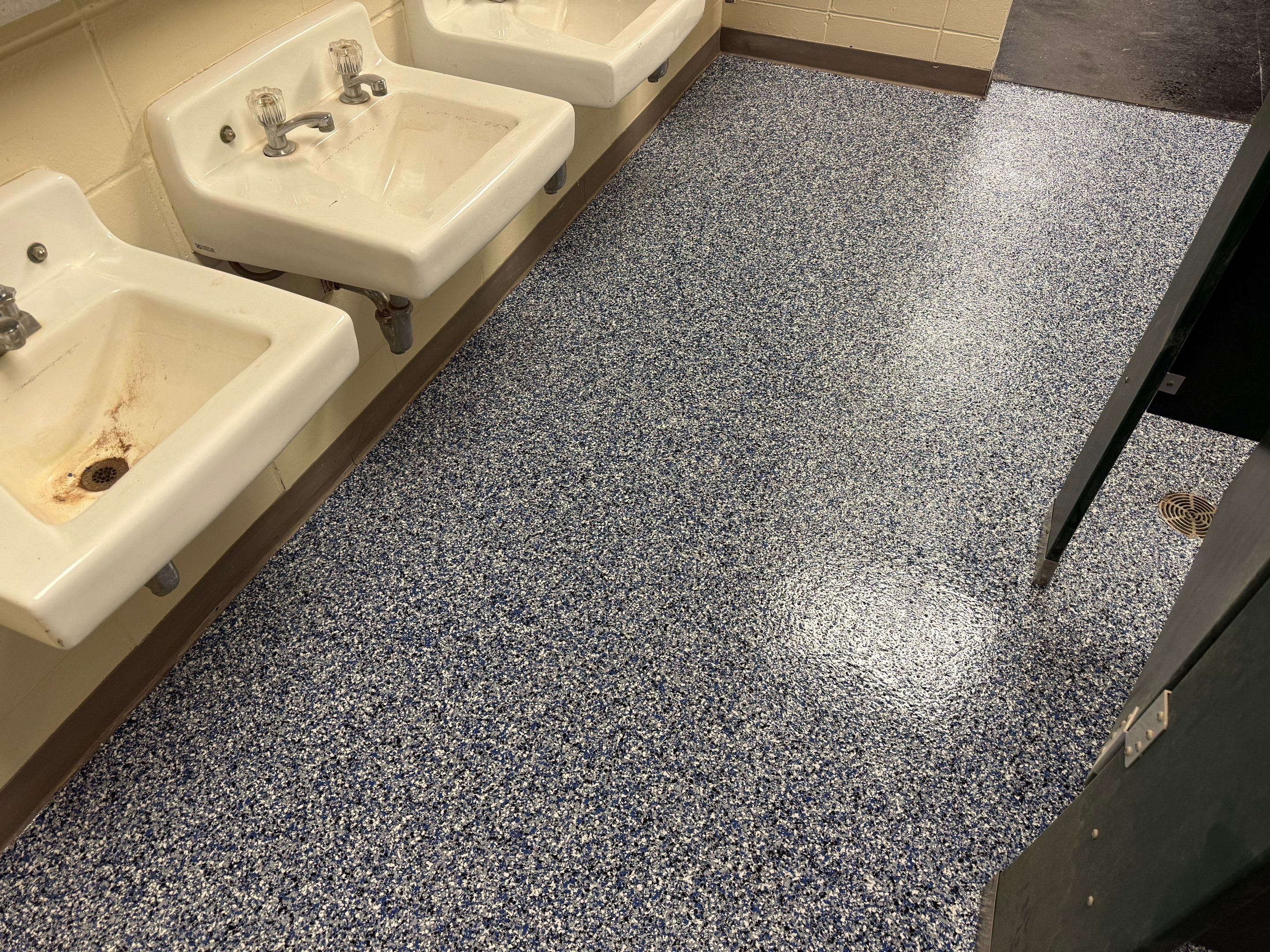 Seamless Epoxy Floor Coating at the Sioux Falls Canaries Facility by Select Painting, Coatings & Garage Cabinets