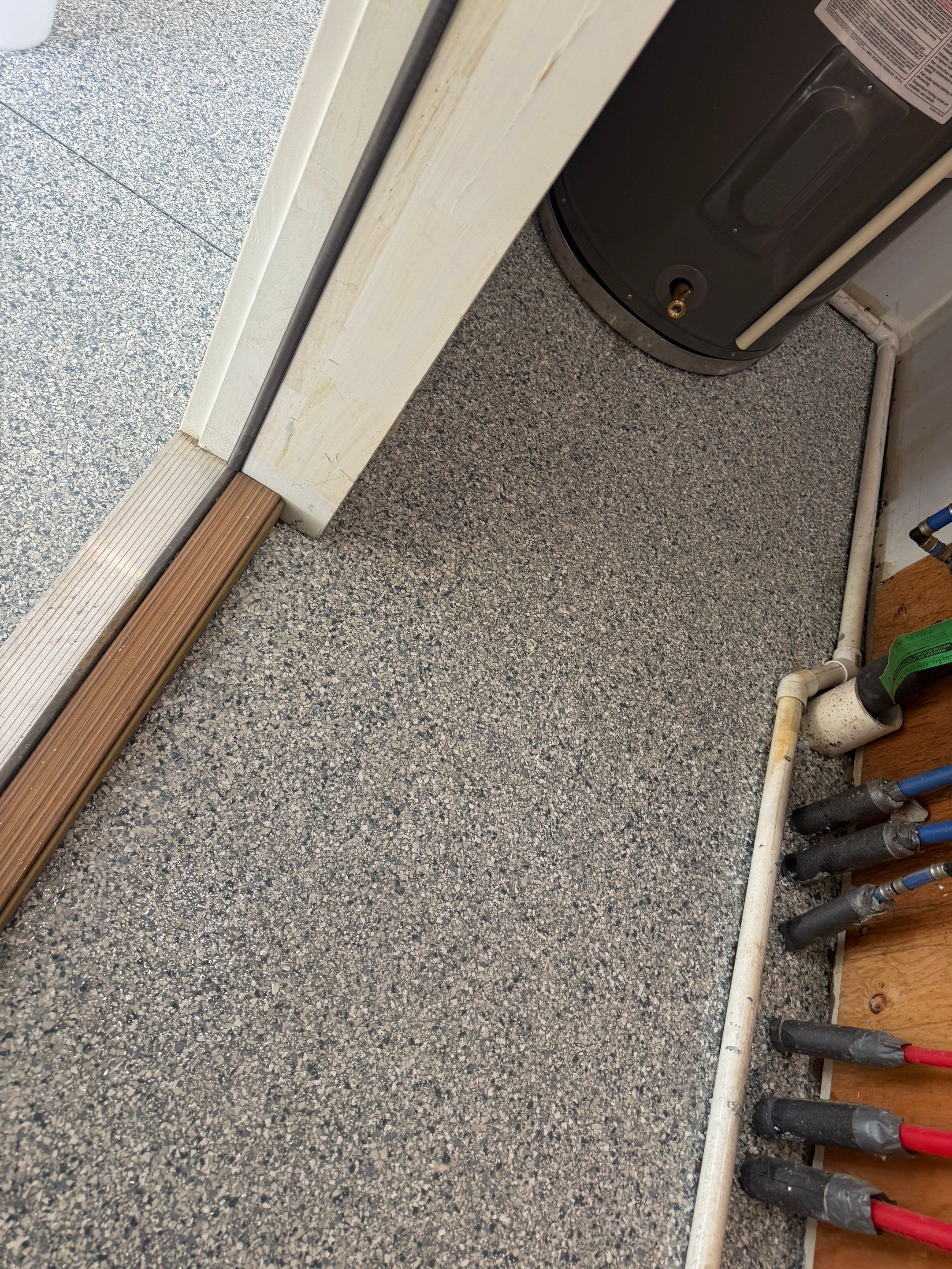 Decorative Chip Epoxy Floor Coating Installation in Sioux Falls by Select Painting, Coatings & Garage Cabinets