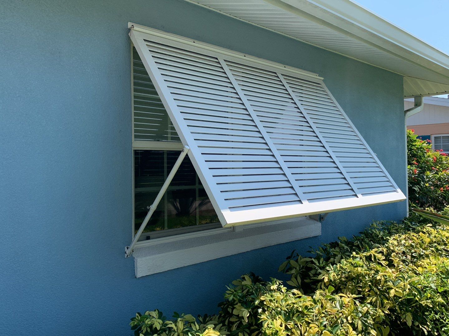 Hurricane Rated Bahama Shutters in Signal White by Smart Guard Shutters