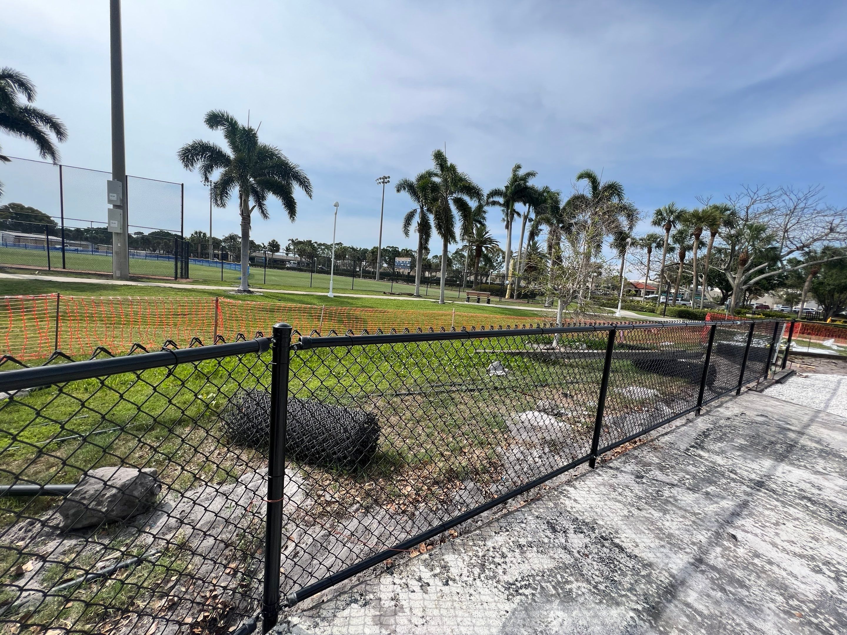Vinyl Coated Chain-link fence for the City of Naples around Fleischmann Park Playground.  by Asap fence and gates, LLC