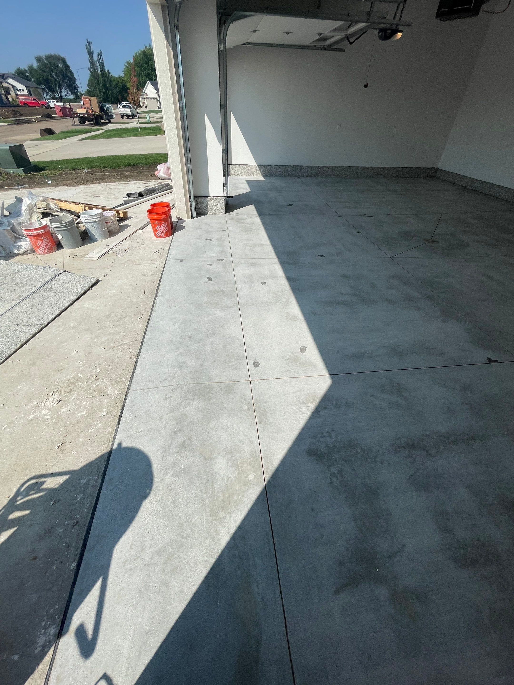 Grey Speckled Garage Floor Coating in Sioux Falls by Select Painting, Coatings & Garage Cabinets
