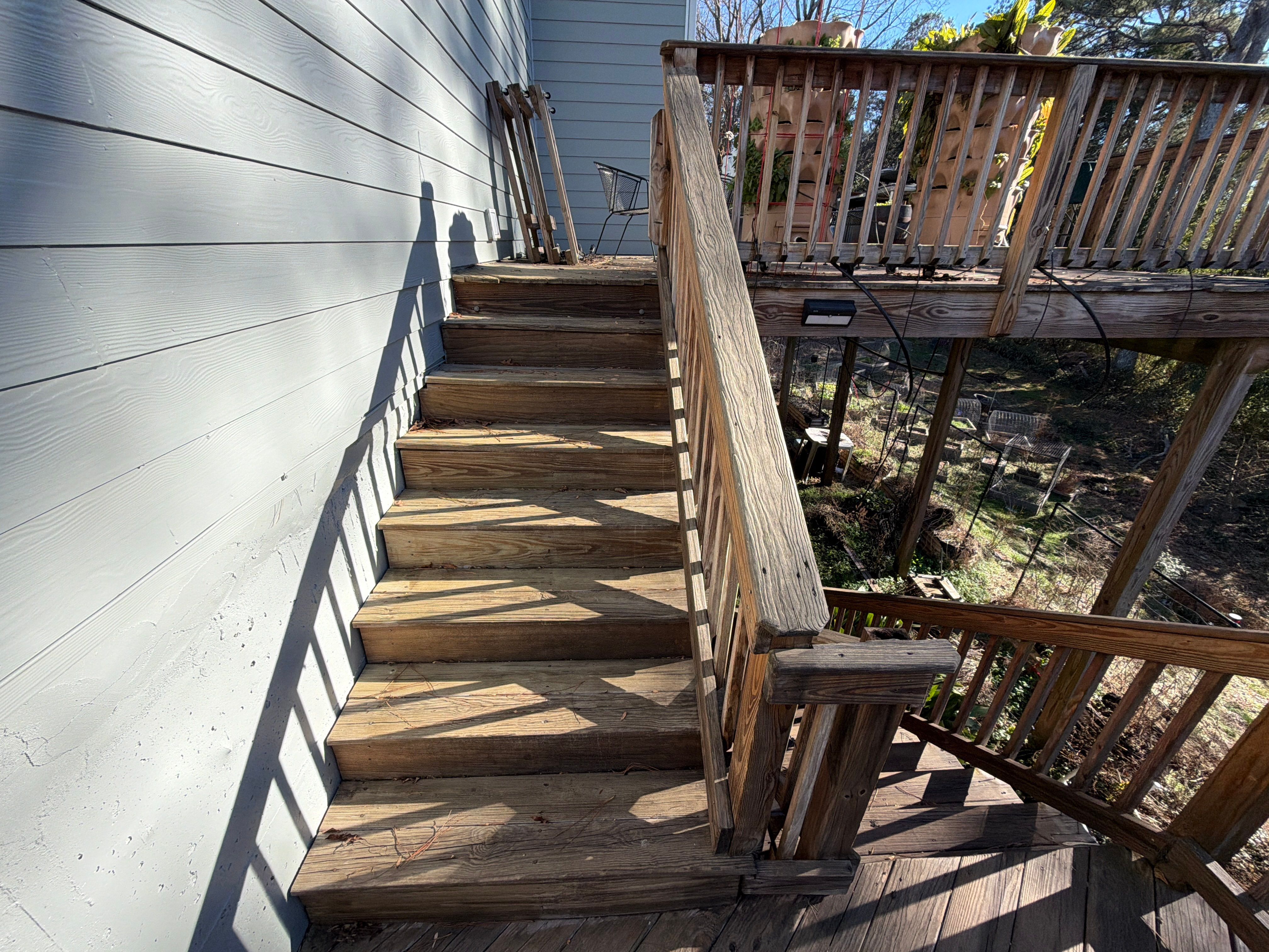 Covered Porch and Deck Build using Deckorators Venture Series Decking and Trex Select Aluminum Railing by Nelson Exteriors