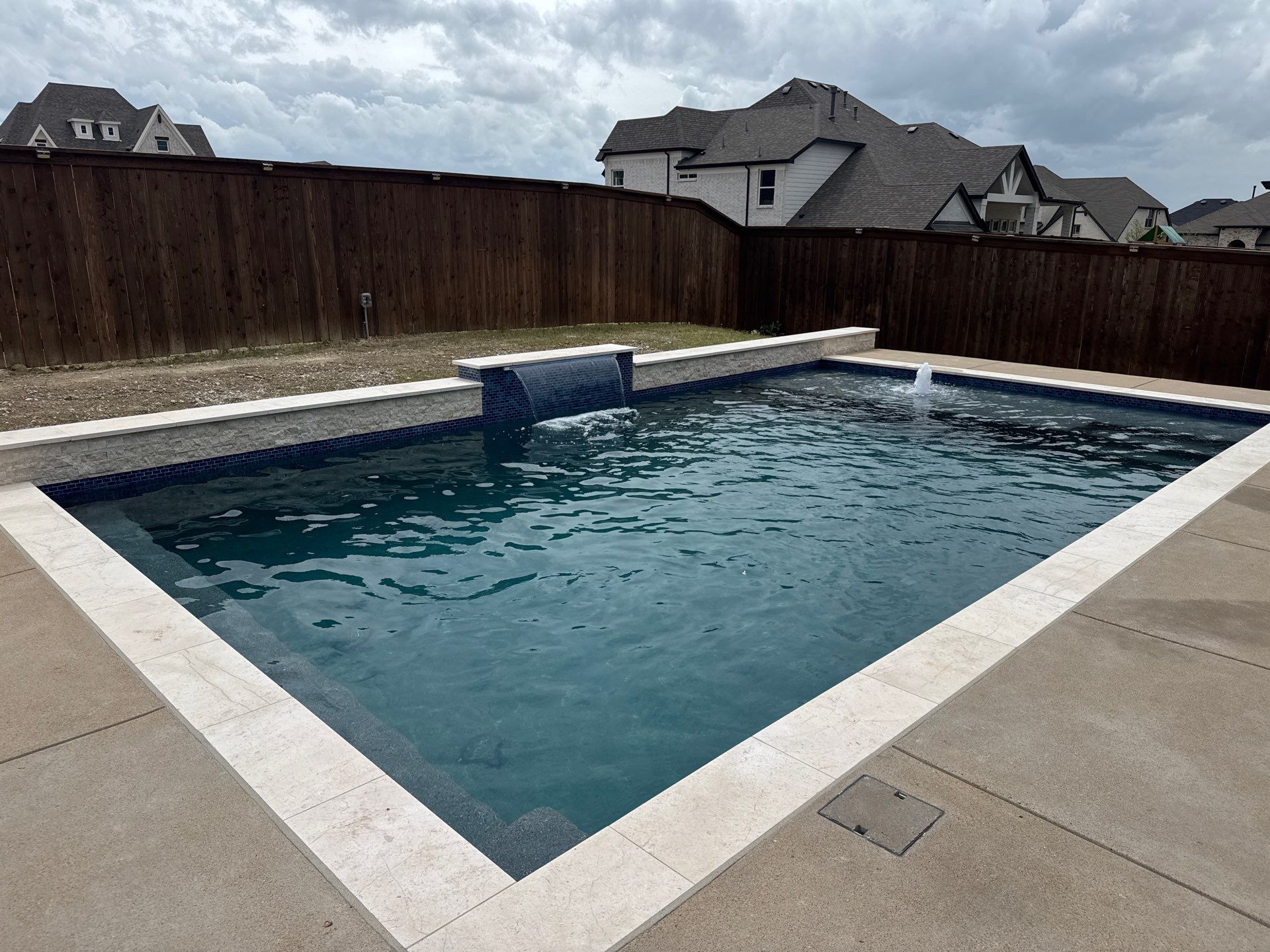Geometric Pool with Tanning Ledge and Bubbler by Pinnacle Pools and Spas - DFW