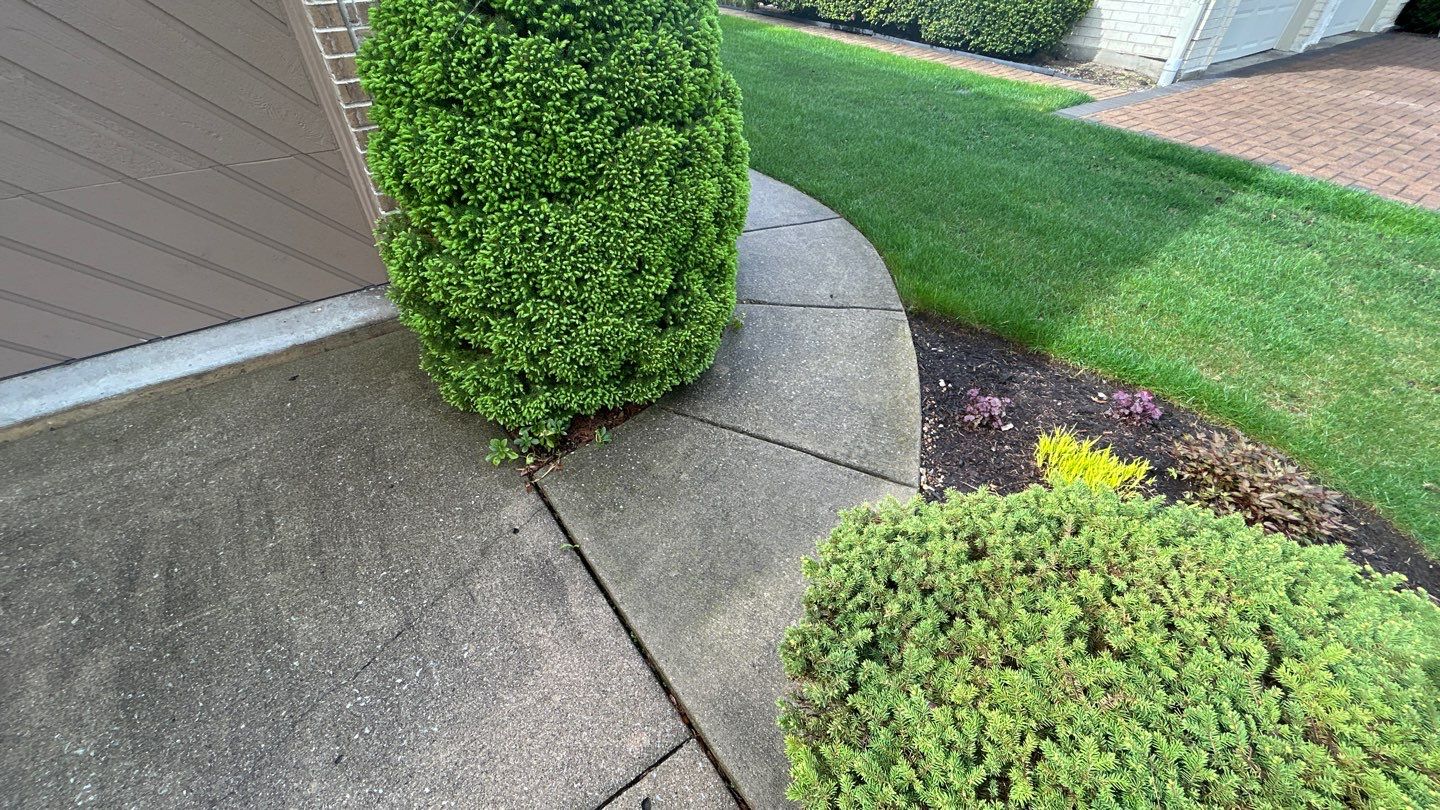 concrete patio and driveway cleaning by Northern Power Washing LLC.