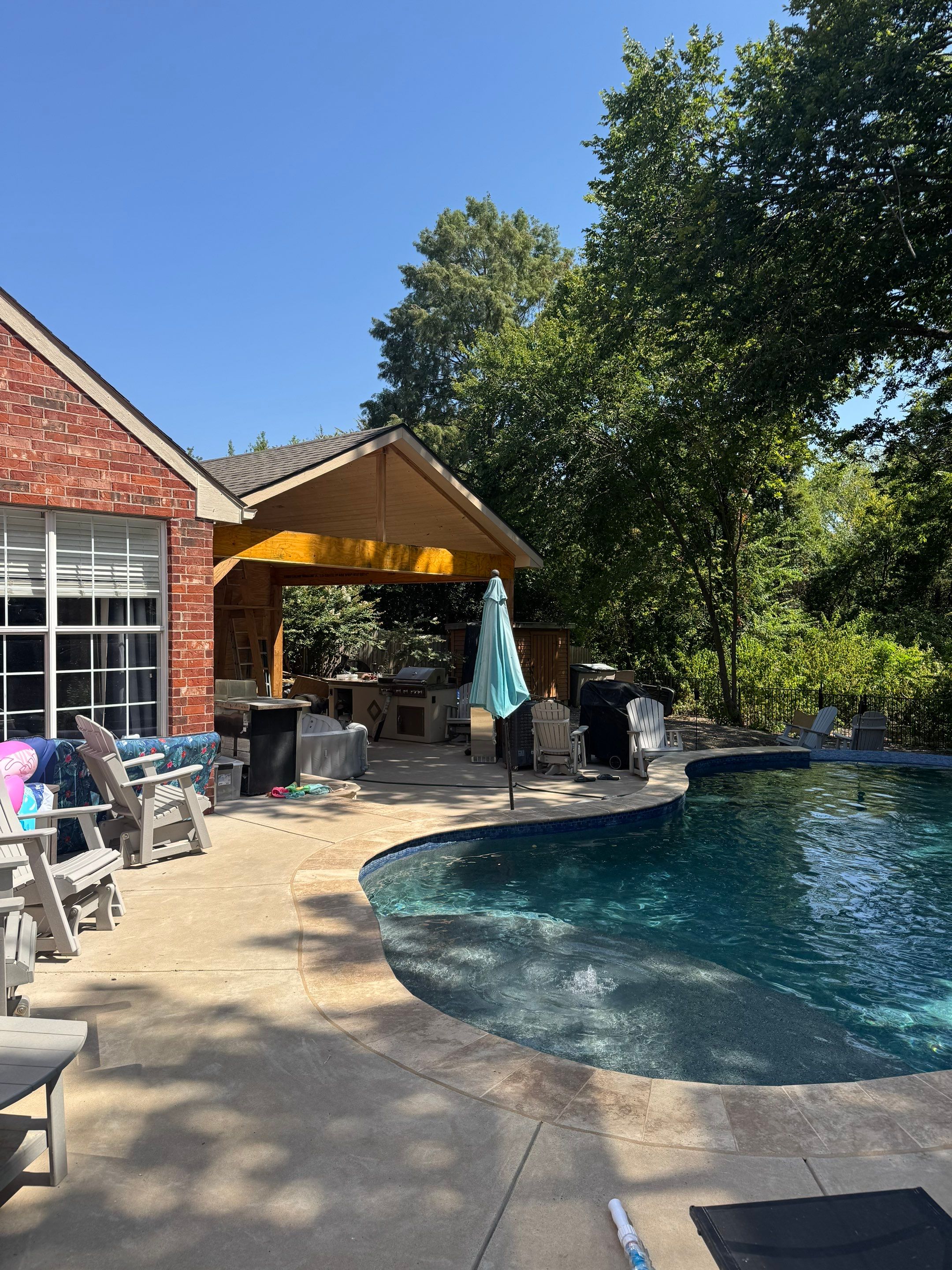 Freeform Pool with Rock Waterfall and Raised Spa by Pinnacle Pools and Spas - DFW